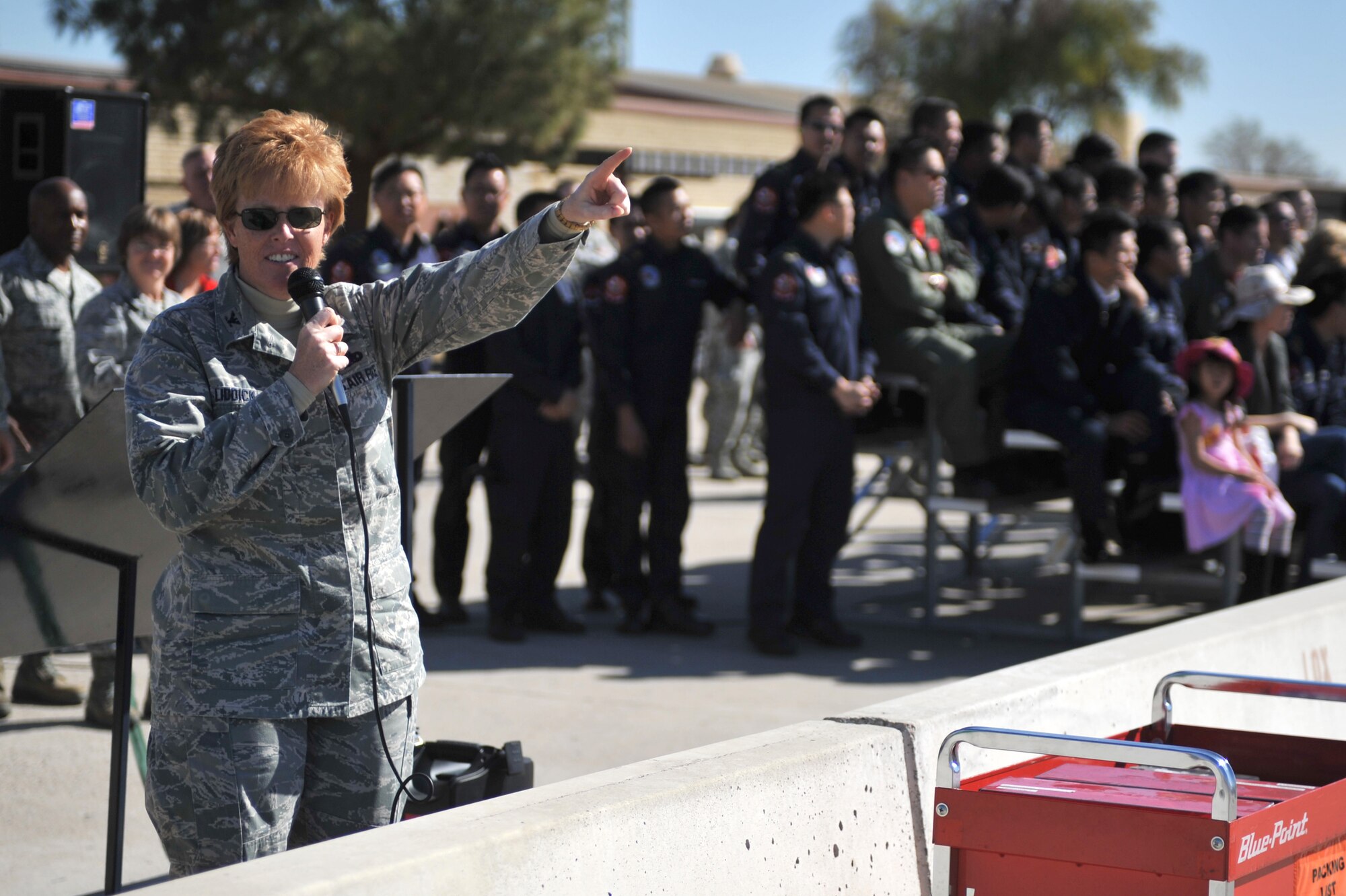 Col. Deborah Liddick, 56th Maintenance Group commander, announces the start of the annual loading competition. The annual loading competition is the four quarterly winners from each aircraft maintenance unit competing against each other for the load crew of the year title.  (U.S. Air Force photo by Senior Airman Sandra Welch)