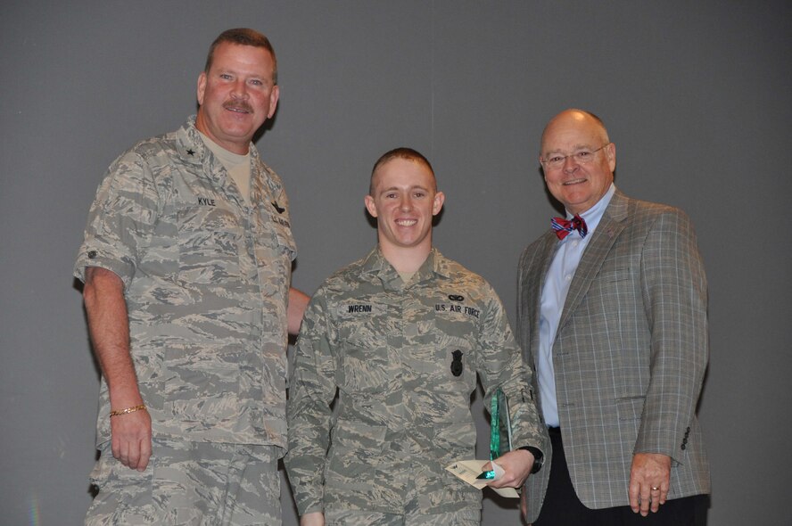 Airman First Class Michael Wrenn (center) stands with Brig. Gen. Mark Kyle, 4th AF commander and Dr. Michael Gooden, 916th honorary wing commander during the February Commander's Call. Wrenn was named Airmen of the Quarter. (USAF photo by 916PA)