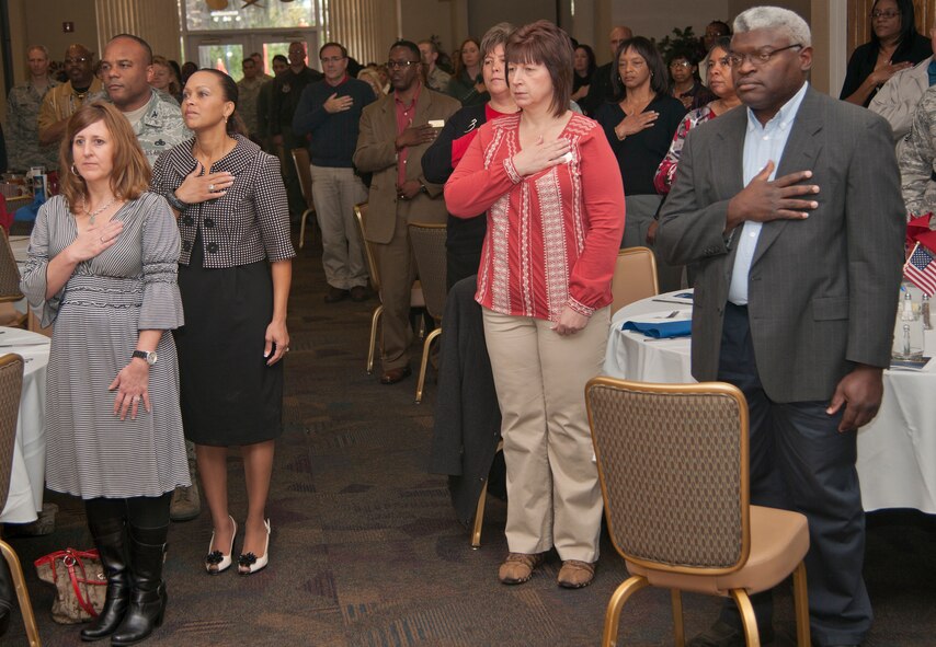 Team Moody members pay their respects during the posting of the colors during the National Prayer Luncheon at Moody Air Force Base, Ga., Feb. 9, 2012. The luncheon’s guest speaker was U.S. Air Force Chaplain (Brig. Gen.) Howard Stendahl, Air Force deputy chief of chaplains. (U.S. Air Force photo by Airman 1st Class Paul Francis/Released)
