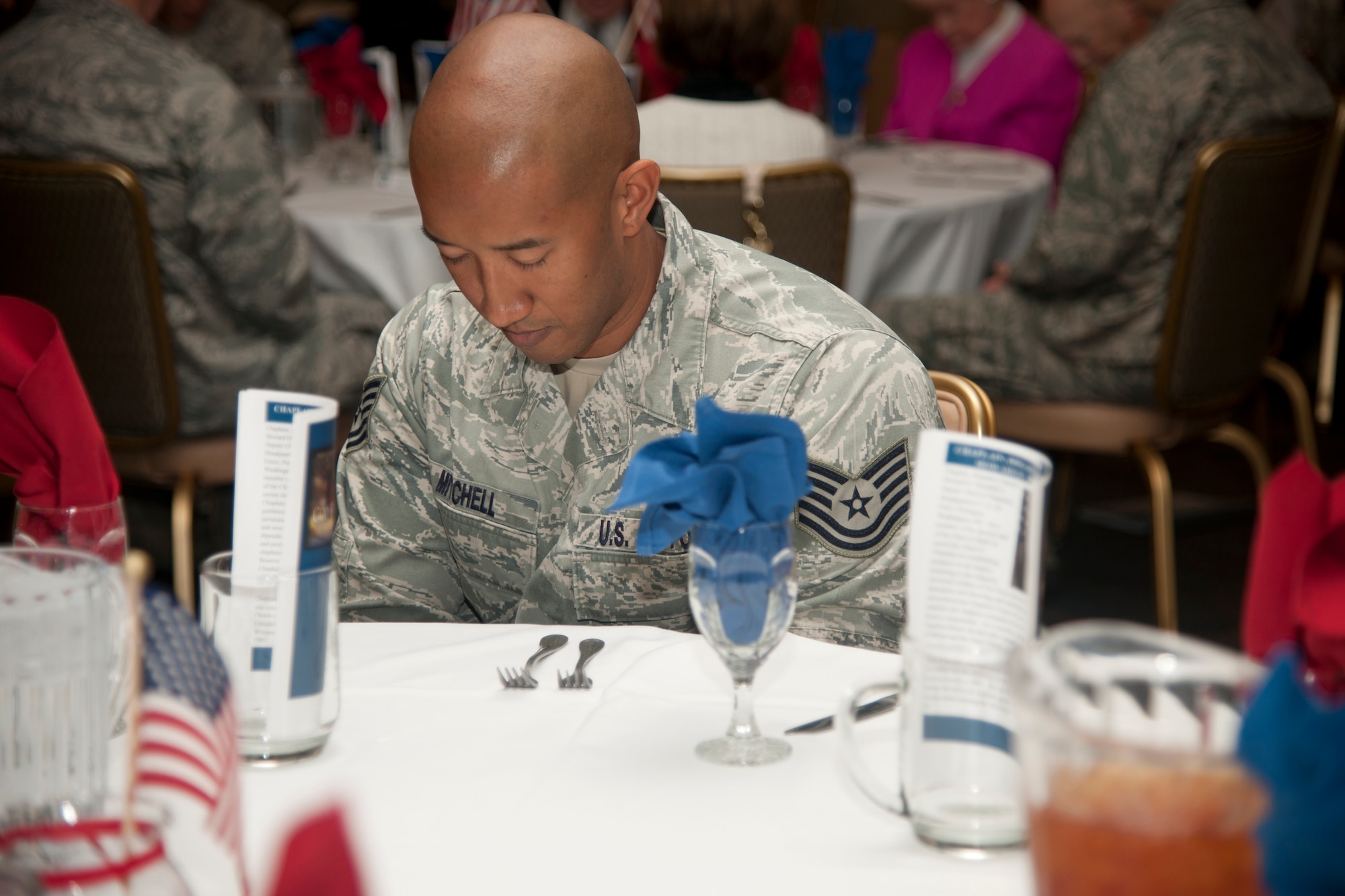 U.S. Air Force Tech. Sgt. Curt Mitchell, 23d Wing ground safety, bows his head during invocation at the National Prayer Luncheon at Moody Air Force Base, Ga., Feb. 9, 2012. The invocation kicked off the luncheon and prepared guests for the speaking of Chaplain (Brig. Gen.) Howard Stendahl, Air Force deputy chief of chaplains. (U.S. Air Force photo by Airman 1st Class Paul Francis/Released)
