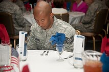 U.S. Air Force Tech. Sgt. Curt Mitchell, 23d Wing ground safety, bows his head during invocation at the National Prayer Luncheon at Moody Air Force Base, Ga., Feb. 9, 2012. The invocation kicked off the luncheon and prepared guests for the speaking of Chaplain (Brig. Gen.) Howard Stendahl, Air Force deputy chief of chaplains. (U.S. Air Force photo by Airman 1st Class Paul Francis/Released)
