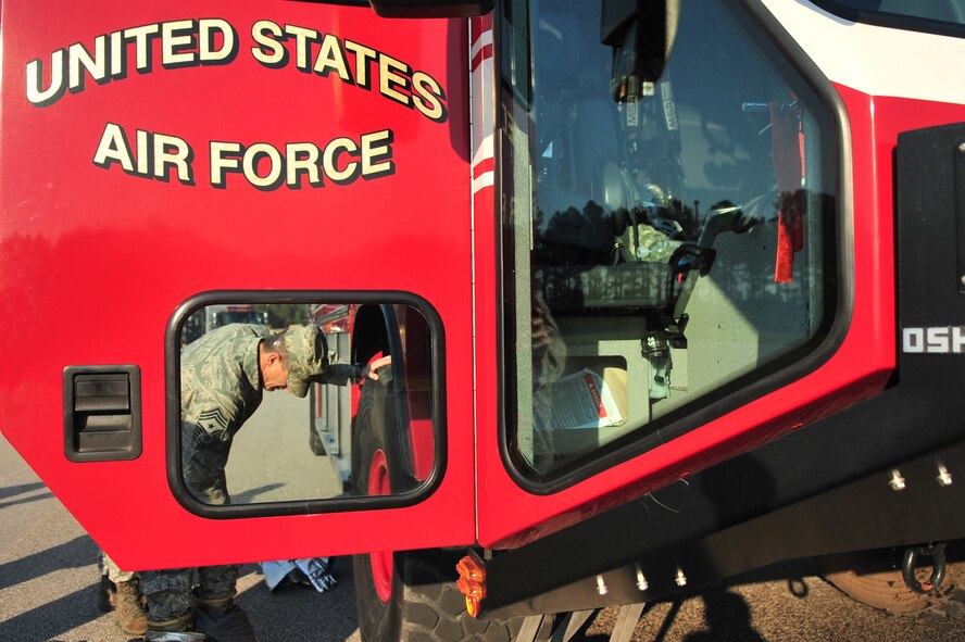U.S. Air Force Chief Master Sgt. Richard Parsons, Air Combat Command command chief, puts on a fire fighter suit to participate in an exercise demo with the Shaw Fire Department, Shaw Air Force Base, S.C. Feb. 8, 2012. He is the enlisted advisor to the commander and staff for the enlisted force stationed at 27 wings, 17 bases and more than 200 operating locations around the world. (U.S. Air Force photo by Airman 1st Class Ashley L. Gardner/ Released)