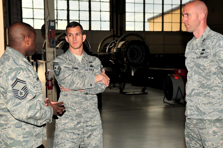 U.S. Air Force Senior Master Sgt. Bennie Robinson and Capt. Robert Montgomery, 20th Component Maintenance Squadron, talks to Chief Master Sgt. Richard Parsons, Air Combat Command command chief, Shaw Air Force Base, S.C. Feb. 8, 2012. He is the enlisted advisor to the commander and staff for the enlisted force stationed at 27 wings, 17 bases and more than 200 operating locations around the world. (U.S. Air Force photo by Airman 1st Class Ashley L. Gardner/ Released)