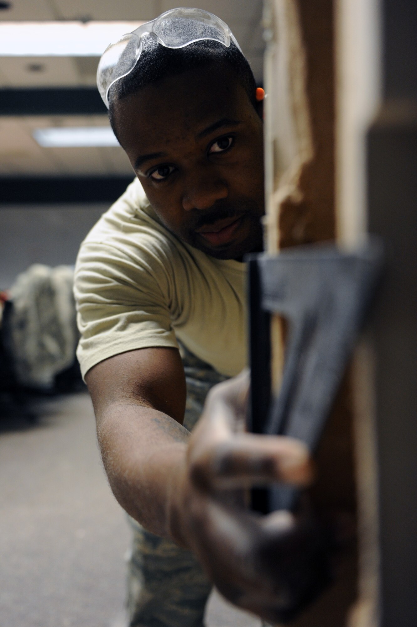 Senior Airman Chris Norwood, a 19th Civil Engineer Squadron structures journeymen, checks to see if the walls are level Feb. 6, 2012, at Little Rock Air Force Base, Ark. The 19th CES ensures access for a global airlift mission by acquiring and improving facilities and the environment, preparing to respond in war and peace, and deploying mission ready war fighters. (U.S. Air Force Photo by Airman 1st Class Rusty Frank)