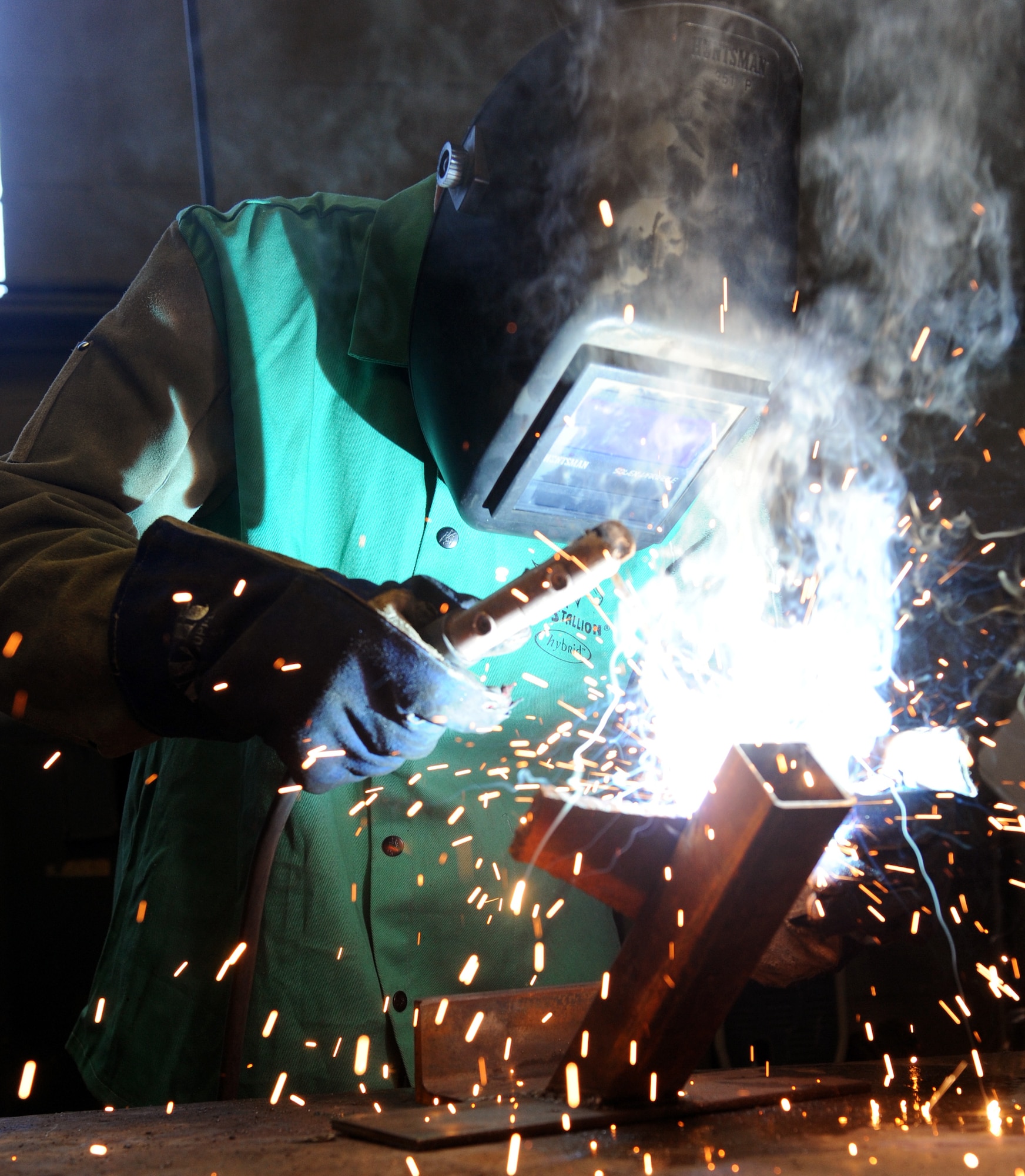 Airman 1st Class Philip Madden, a 19th Civil Engineer Squadron structures apprentice, uses a shield metal arc welder on a piece of metal, Feb. 2, 2012, at Little Rock Air Force Base, Ark. The 19th CES provides global combat support using transformational business practices and innovative technologies supporting combatant commanders. (U.S. Air Force Photo by Airman 1st Class Rusty Frank)
