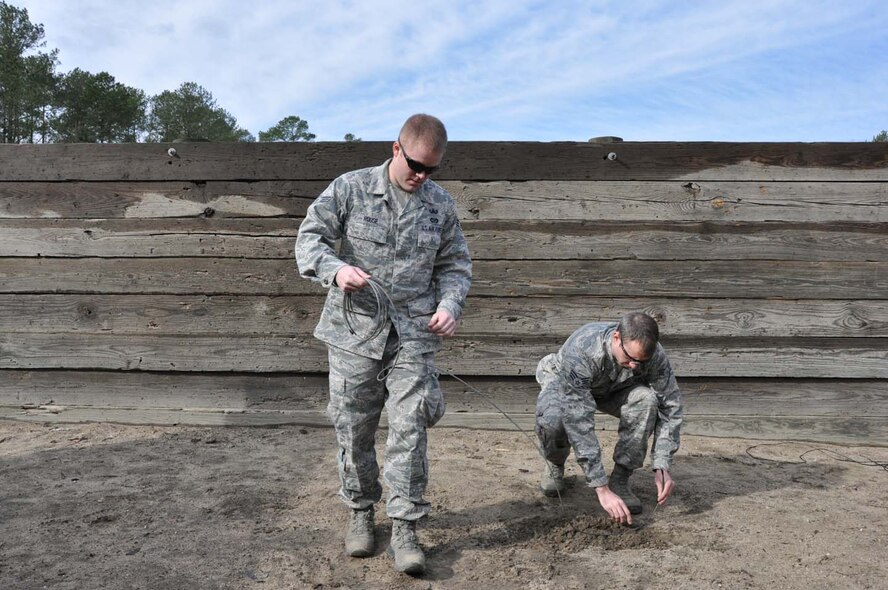 Senior Airmen Nicholas Roose (left) and James Ingalls prepare for a detonation exercise in late January here. The reservists are the newest explosive ordinance device technicians with the 916th Civil Engineer Flight. (USAF photo by MSgt. Wendy Lopedote, 916ARW/PA)