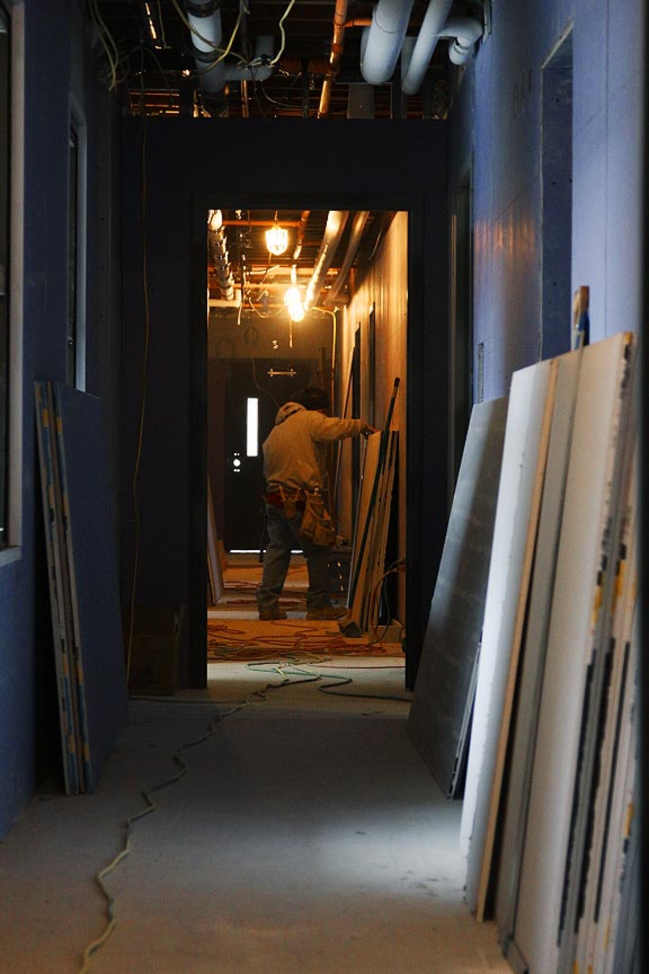 Civilian construction employees finish the last insulation preparations in support of the remodeling process on building 219, Feb. 10, 2012. This newly remodeled building will provide lodging for Airmen during unit training assemblies and annual training tours, as well as accommodations for other Department of Defense personnel. (U.S. Air Force photo by Tech. Sgt. Ralph Van Houtem/Released)