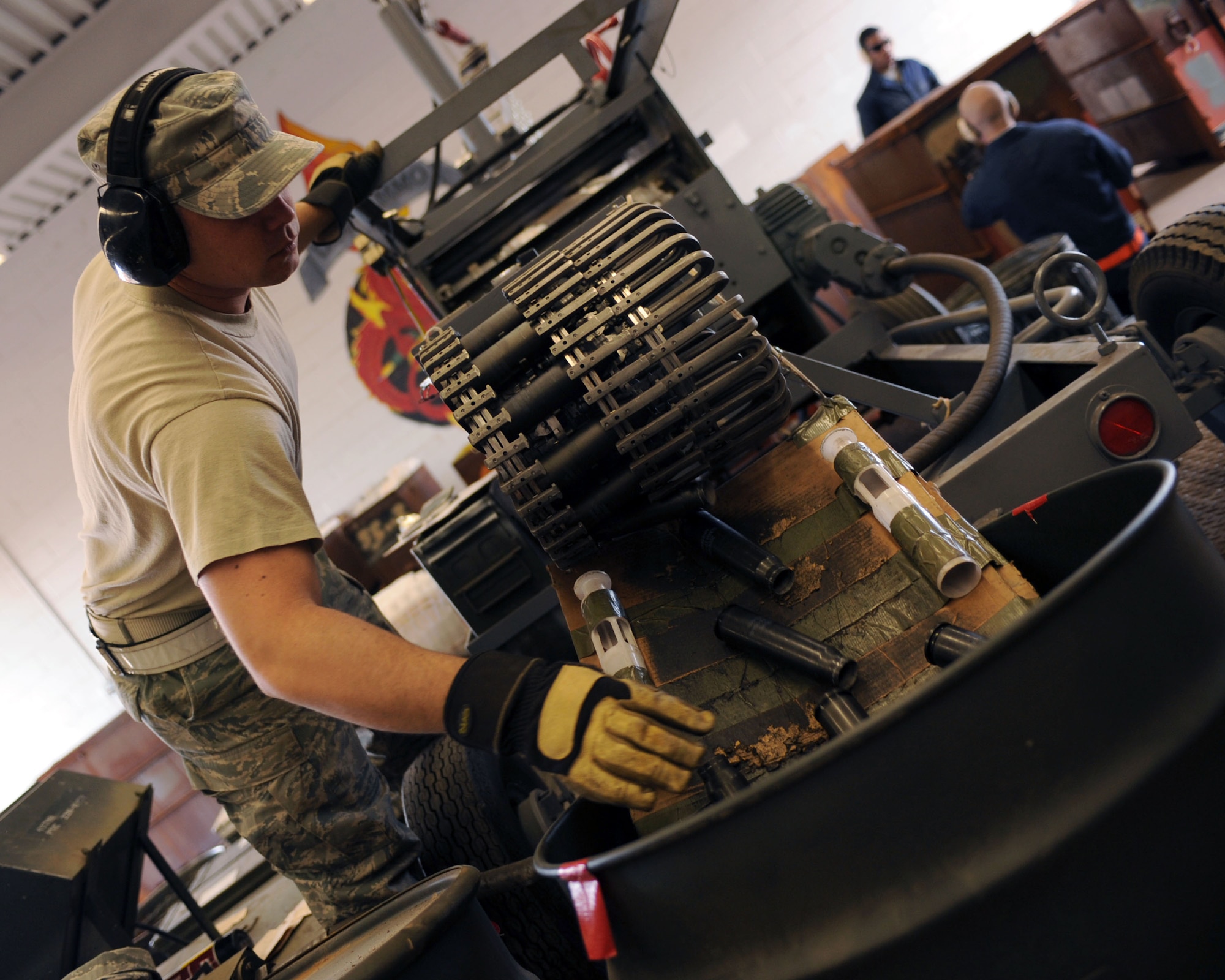U.S. Air Force Staff Sgt. Brent Stockton, 355th Equipment Maintenance Squadron sorts rounds as they come out of the GFU-7 on Davis-Monthan Air Force Base, Ariz., Feb. 8, 2012. (U.S. Air Force photo by Airman 1st Class Christine Griffiths/Released) 