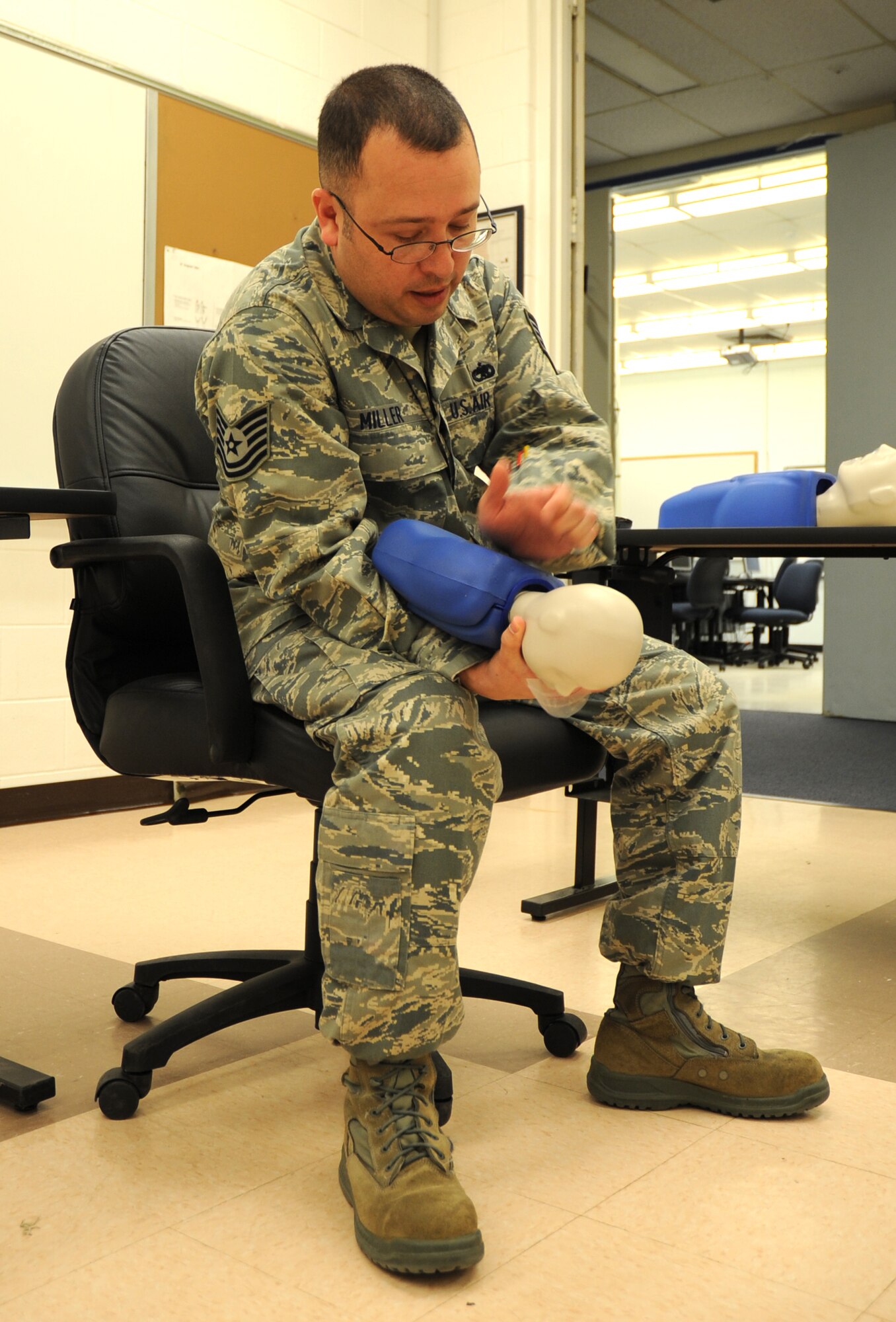 U.S. Air Force Airman Eric Krause, 27th Special Operations Equipment Maintenance Squadron, practices infant chest compressions on his CPR dummy in a training detachment at Cannon Air Force Base, N.M., Feb. 8, 2012. The CPR course provided is through the American Heart Association and is required by the 27th Special Operations Maintenance Group every two years. (U.S. Air Force photo by Airman 1st Class Alexxis Pons Abascal) 