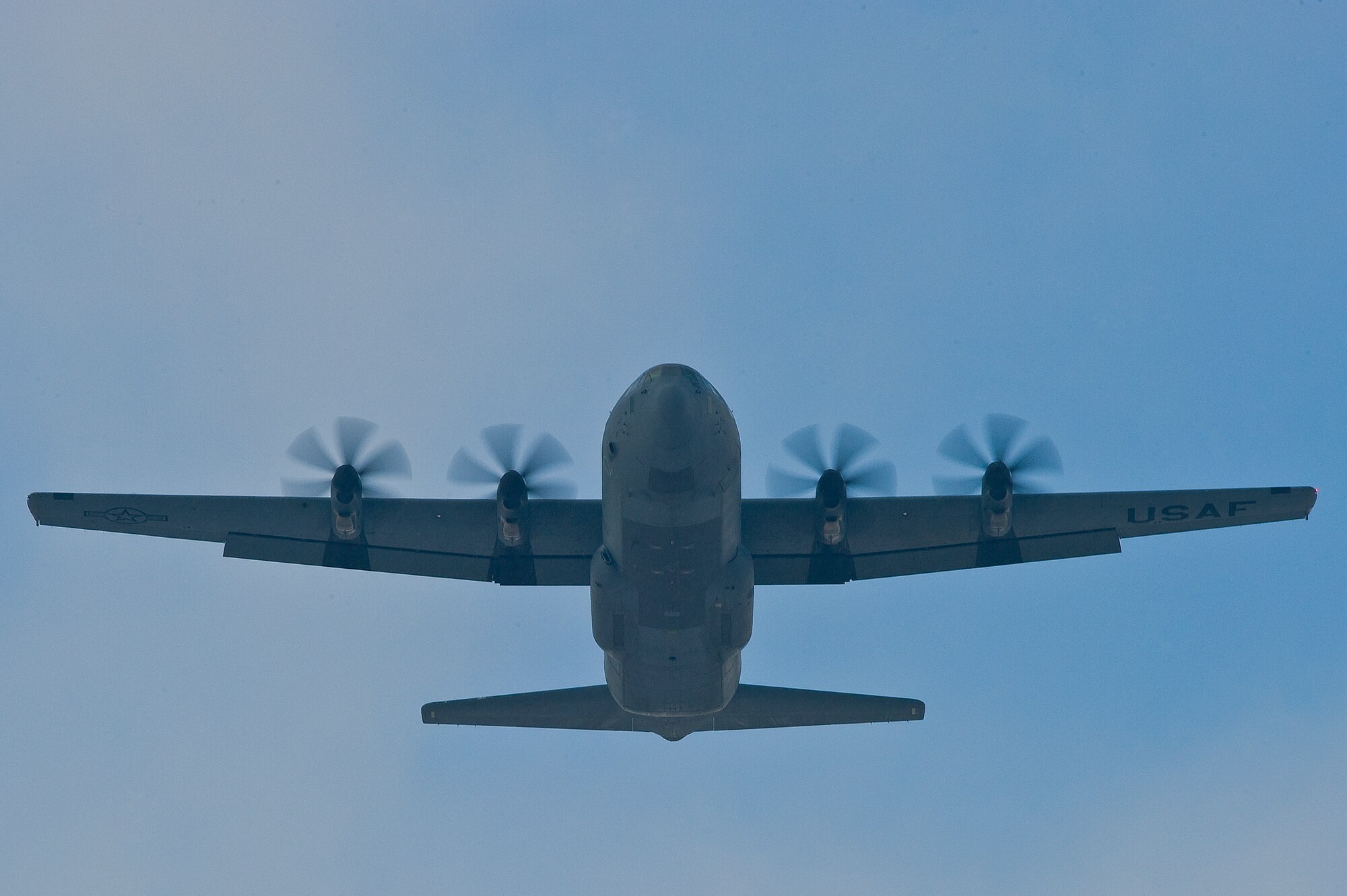 A U.S. Air Force C-130J Super Hercules assigned to the 37th Airlift Squadron, Ramstein Air Base, Germany, conducts a mass airdrop of paratroopers from the U.S. Army's 173rd Airborne Brigade Combat Team, out of Aviano Air Base, Italy, Feb. 10, 2012. The mass airdrop over Alzey, Germany, commemorated 70 years of combat airlift capabilities for the 37th AS. (U.S. Air Force photo by Senior Amn. Stephen J. Otero)