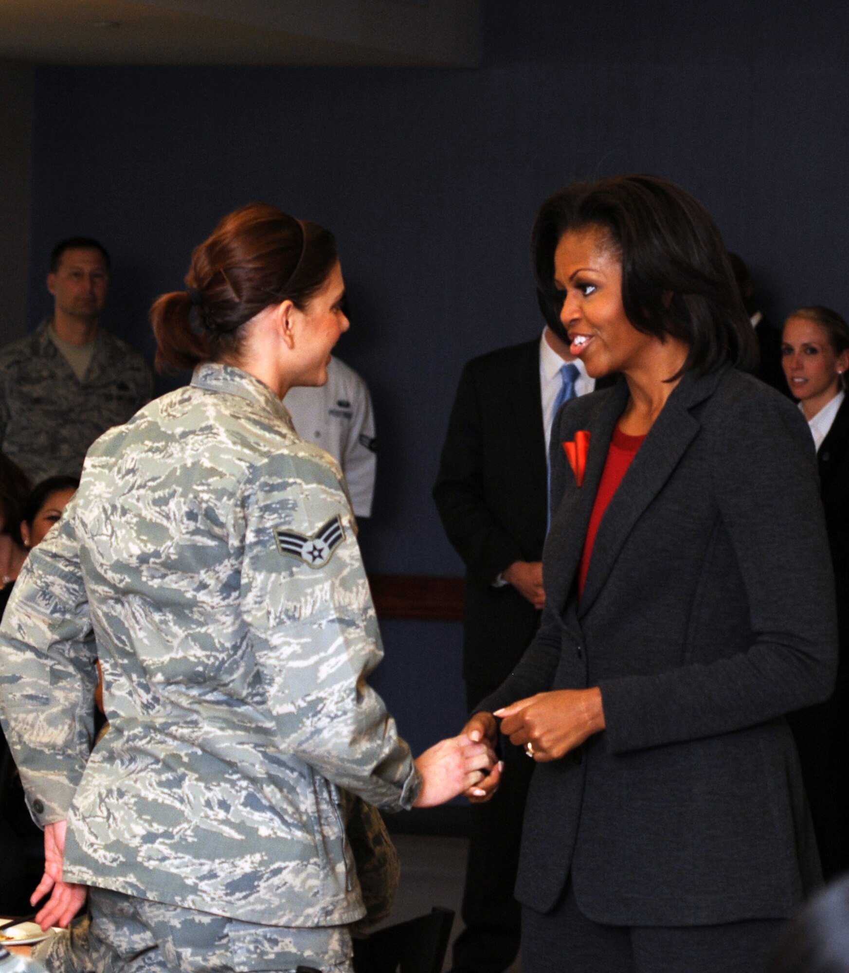 Michelle Obama speaks to an Airman at Little Rock Air Force Base, Ark., Feb. 9, 2012. Little Rock AFB is one of six bases to implement the pilot Food Transformation Initiative program, designed to provide a wider variety of nutritional meals to service members and their families. (U.S. Air Force photo/Airman 1st Class Rusty Frank)