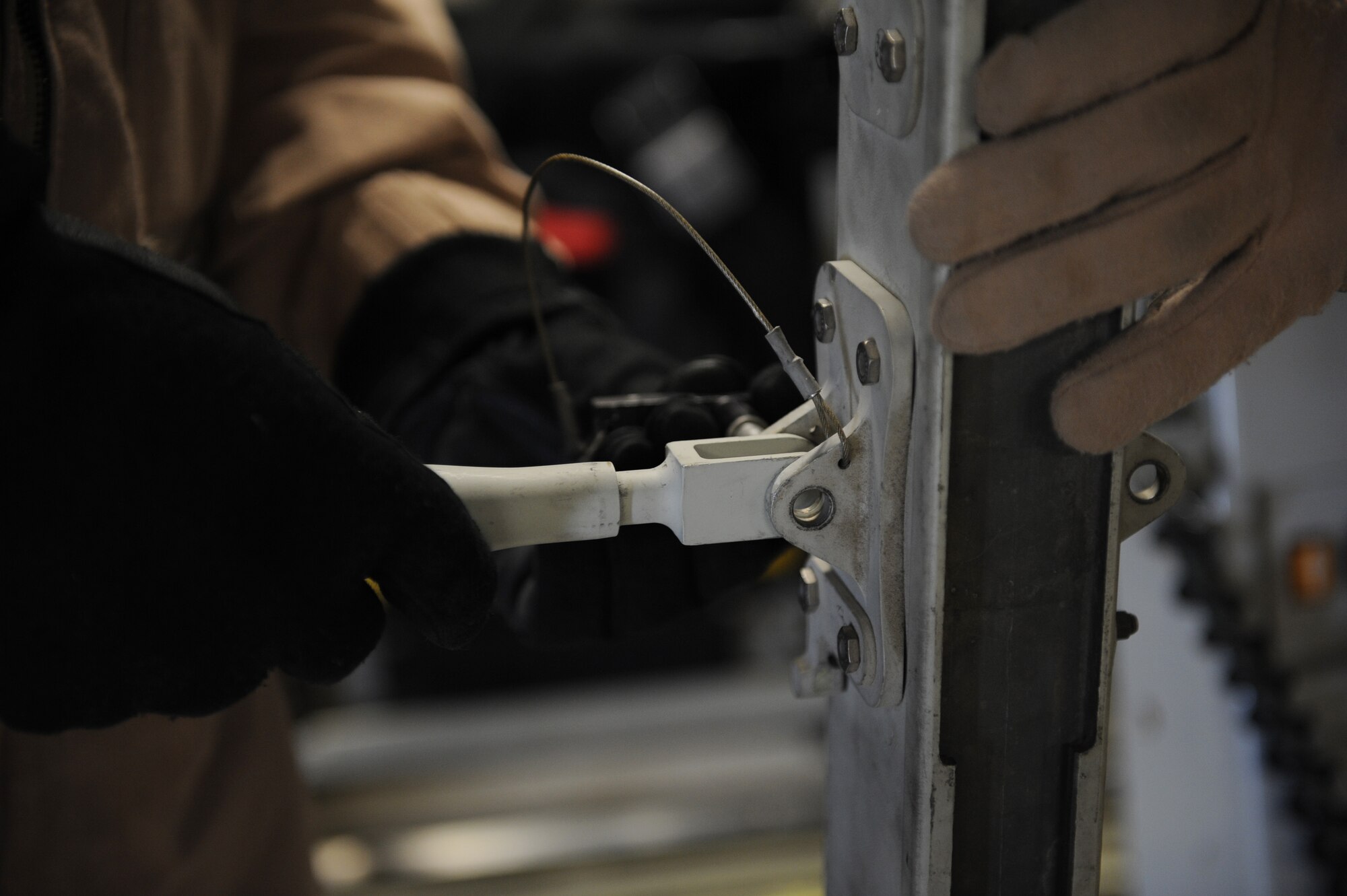 Maj. Debra Sims, 379th Expeditionary Aeromedical Evacuation Squadron flight nurse and Dallas native, and Staff Sgt. Richard Brampton, a 379th EAES medical technician and Camano Island, Wash. native, assemble a litter station on a C-17 Globemaster here Feb. 10, 2012. Sims and Brampton recently took part in a priority evacuation of hostages rescued from Somalia. Sims and Brampton are currently deployed from Scott Air Force Base, Ill. (U.S. Air Force photo/Staff Sgt. Nathanael Callon)