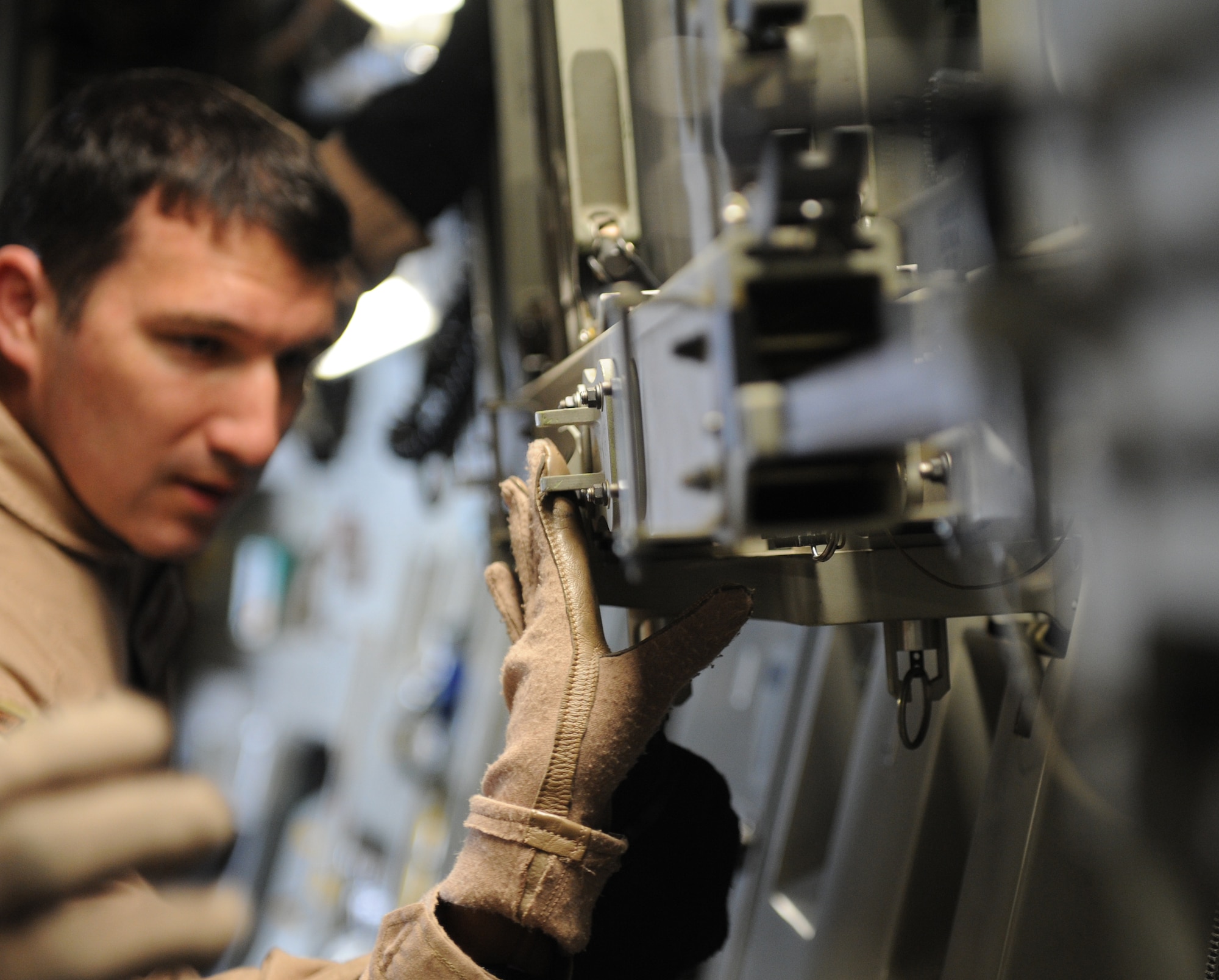 Staff Sgt. Richard Brampton, a 379th Expeditionary Aeromedical Evacuation Squadron medical technician and Camano Island, Wash., native, prepares to assemble a litter station on a C-17 Globemaster here Feb. 10, 2012. Litter stations are used to transport intensive care patients aboard an aircraft. Ennis recently took part in a priority evacuation mission of hostages rescued from Somalia.  Ennis is currently deployed from Pope Field, N.C. (U.S. Air Force photo/Staff Sgt. Nathanael Callon)