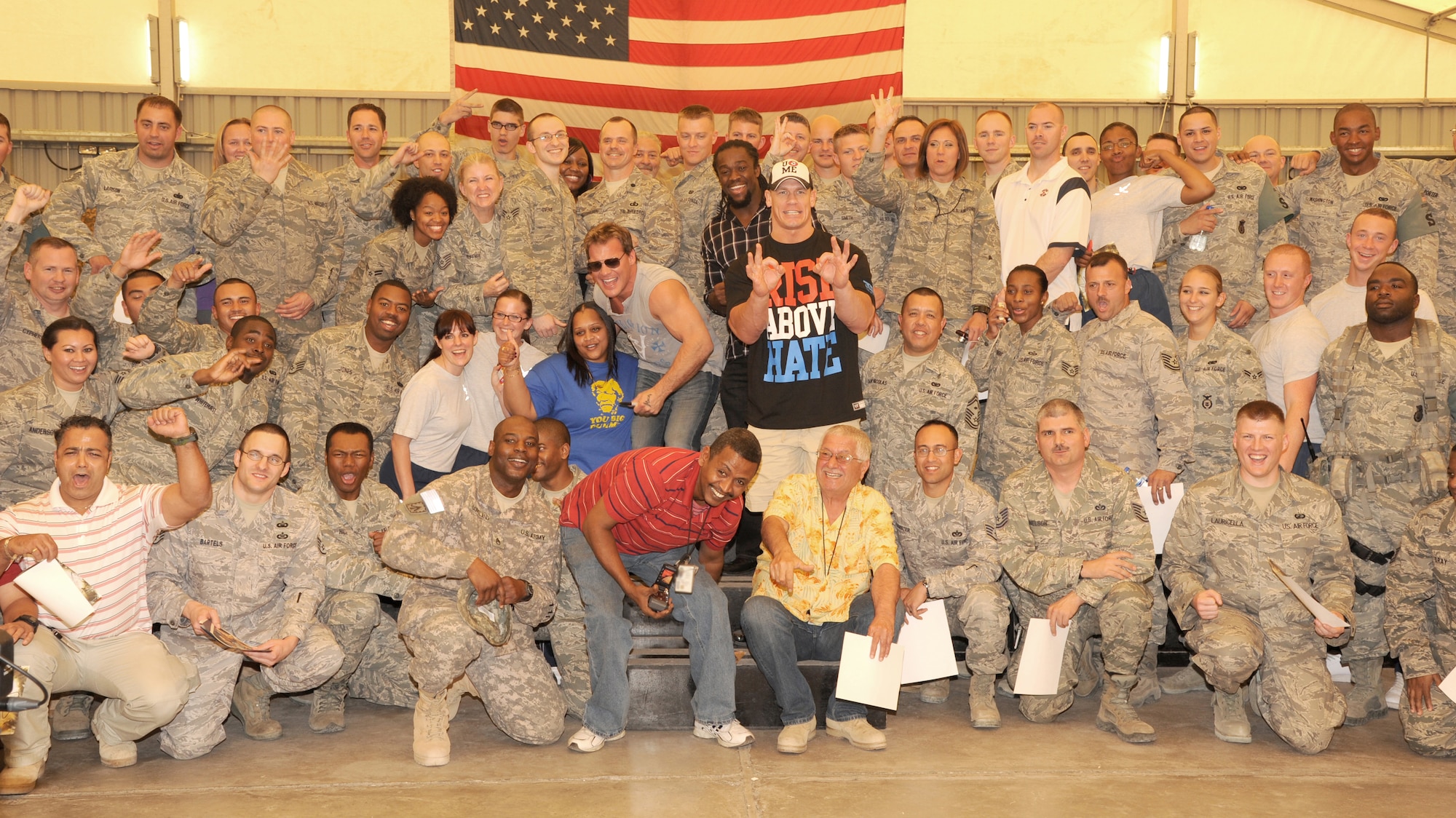 SOUTHWEST ASIA - World Wrestling Entertainment superstars John Cena, Chris Jericho and Kofi Kingston visit with members from the 380th Air Expeditionary Wing Feb. 10, 2012. As part of a USO tour, the wrestlers took photos and signed autographs with more than 200 Airmen and Soldiers assigned to the wing. (U.S. Air Force photo/Tech. Sgt. Arian Nead)