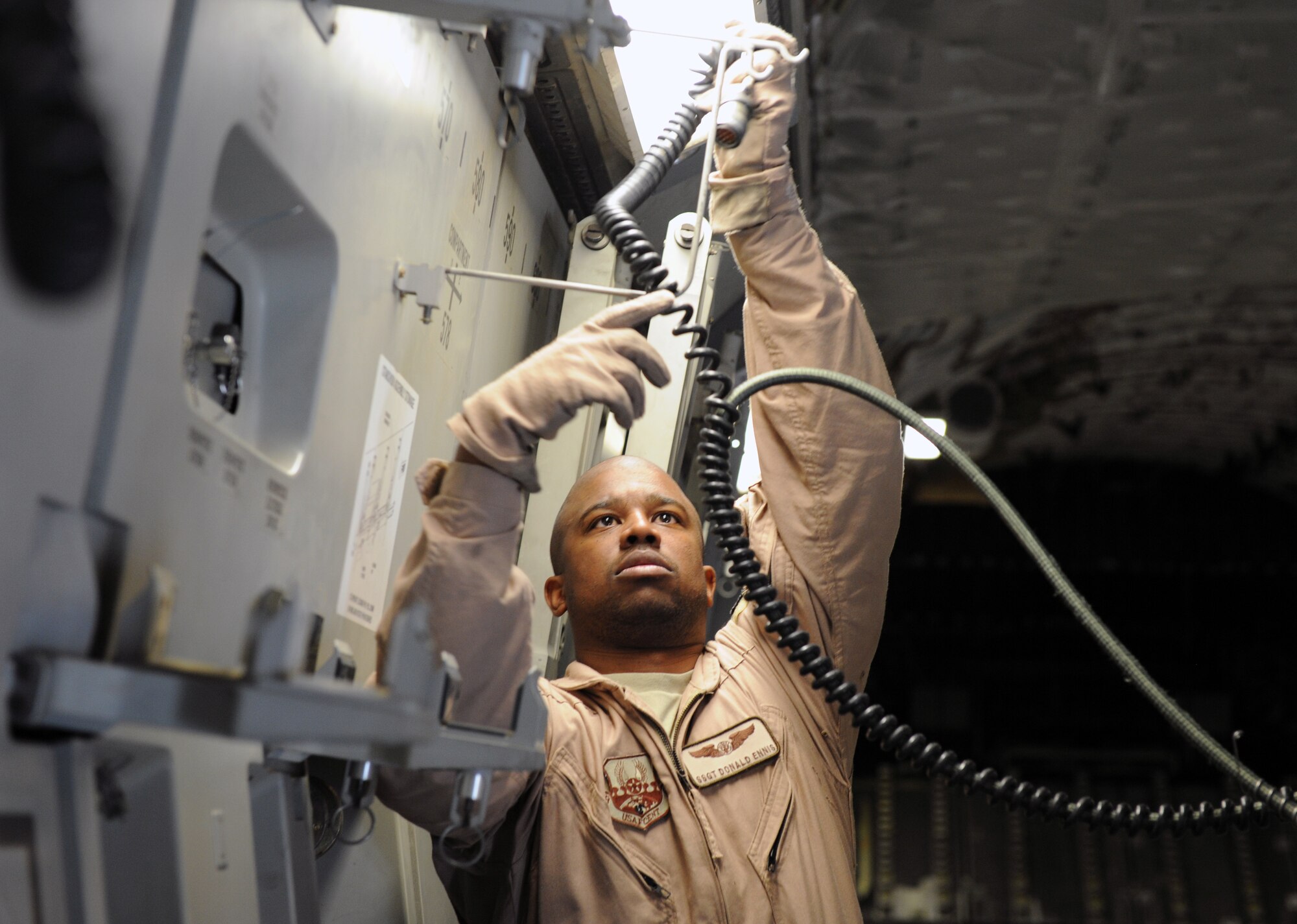 SOUTHWEST ASIA – Staff Sgt. Donald Ennis, a 379th Expeditionary Aeromedical Evacuation Squadron medical technician and Washington, D.C., native, assembles a litter station on a C-17 Globemaster here Feb. 10, 2012. Litter stations are used to transport intensive care patients aboard an aircraft. Ennis recently took part in a priority evacuation mission of hostages rescued from Somalia.  Ennis is currently deployed from Pope Field, N.C. (U.S. Air Force photo/Staff Sgt. Nathanael Callon)
