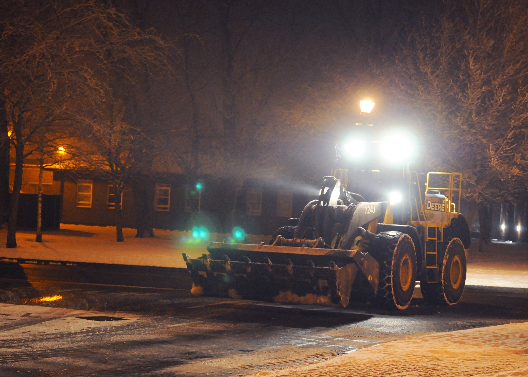 RAF MILDENHALL, England – A member of the 100th Civil Engineer Squadron Heavy Equipment Flight grades a road during the wee hours of the morning here Feb. 10, 2012.  The ‘dirt boys’ ensured RAF Mildenhall roads were safe for drivers commuting on base after snowy weather. (U.S. Air Force photo/Staff Sgt. Tabitha M. Lee)