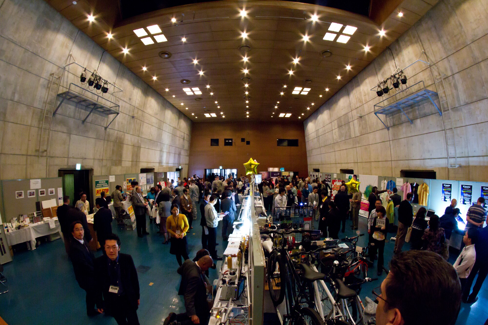 Members of the Okinawan community and U.S. military members wander around this year’s Okinawa First Vendor Showcase in Okinawa, Japan, Feb. 3, 2012. The showcase is designed to provide military members with more possibilities of what can be purchased locally instead of having supplies shipped in from the United States. (U.S. Air Force photo by Senior Airman George Halley/Released)