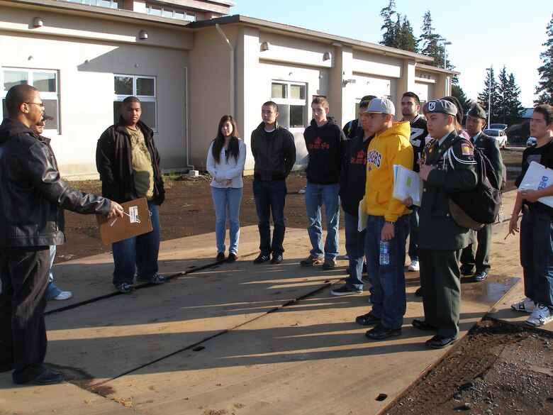 Japan Engineer District engineer Cedric Bazemore instructs all contractor teams at the kick-off of the 2011 Bid Proposal competition Nov. 17  sponsored by Zama High School and Japan District, U.S. Army Corps of Engineers.