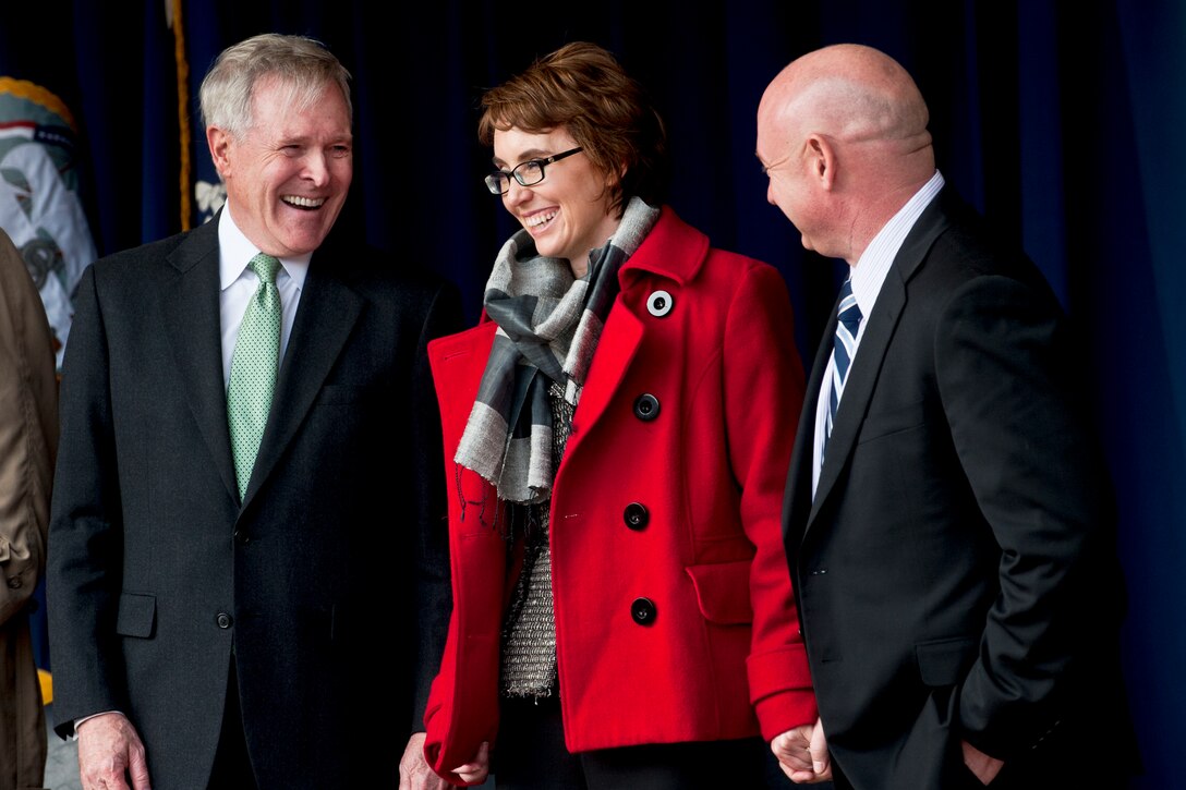 Navy Secretary Ray Mabus, former U.S. Rep. Gabrielle Giffords of Arizona and her husband, retired astronaut Mark Kelly, attend a ceremony at the Pentagon, Feb. 10, 2012.