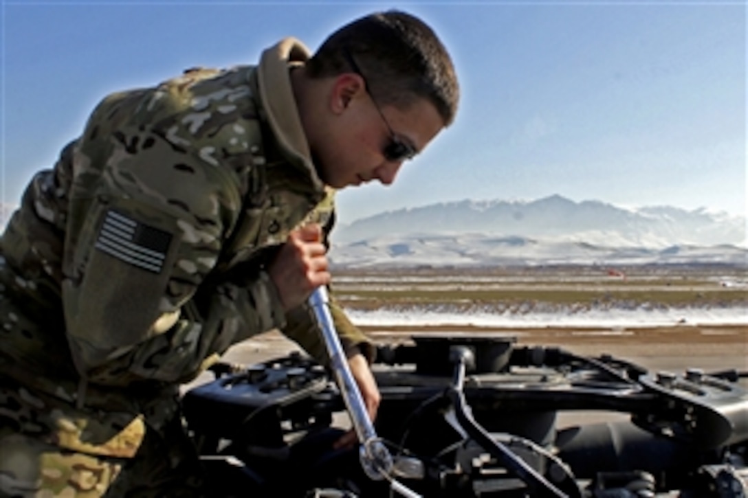 U.S. Army Pfc. James Dennis performs a torque check on the main rotor head of a UH-60 Black Hawk helicopter at Camp Marmal, Afghanistan, on Feb. 7, 2012.  Dennis is a crew chief assigned to the 1st Cavalry Division's Company A, 1st Air Cavalry Brigade.  