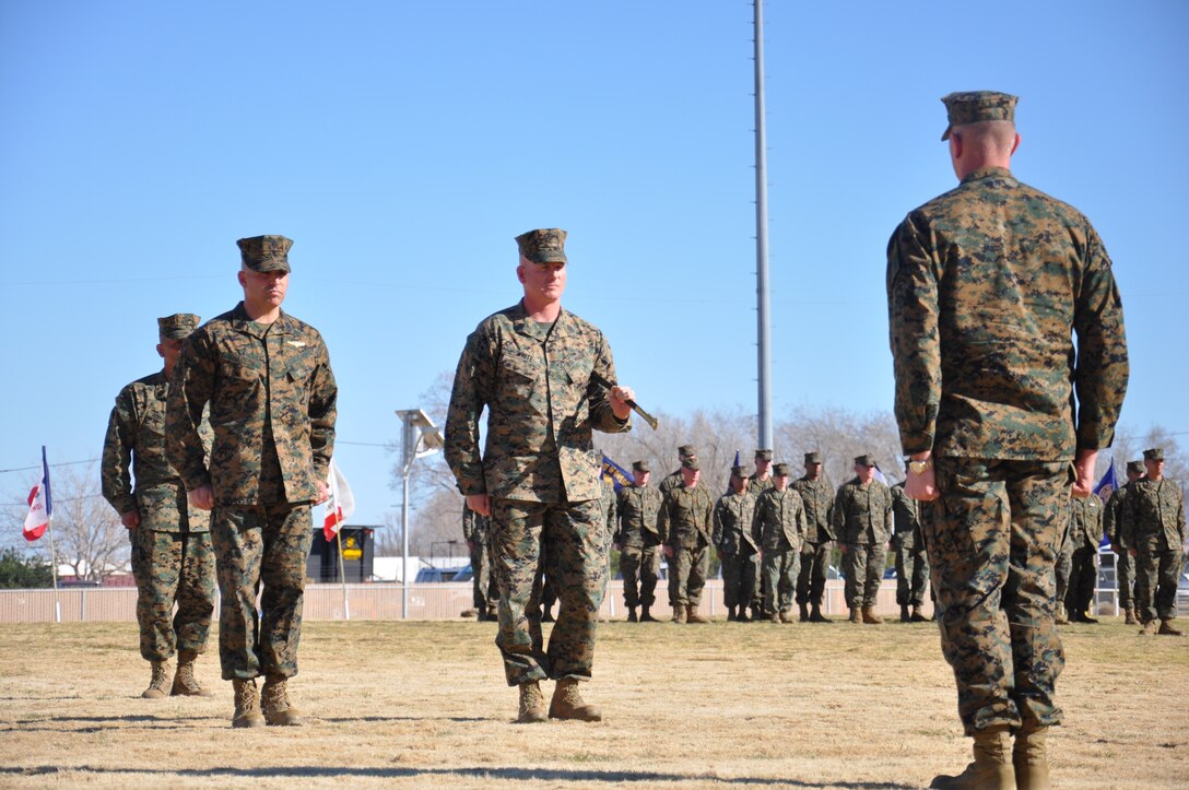 Sergeants Major Richard Charron (left) and Donovan G. White Jr. (center) stand in front of the commanding officer of Marine Corps Logistics Base Barstow, Col. Daniel P. Ermer during the relief and appointment ceremony, Feb. 10.