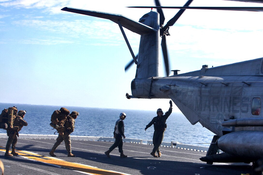 Marines and sailors from 3rd Amphibious Assault Battalion, 1st Marine Division, file into a CH-53E helicopter on the flight deck of the USS Peleliu, Feb. 10. The servicemembers were bound for San Clemente Island for the culminating training event of Exercise Iron Fist 2012, a bilateral training event between the 15th Marine Expeditionary Unit and the Japanese Ground Self Defense Force and encompasses all aspects of the Marine Air Ground Task Force.
