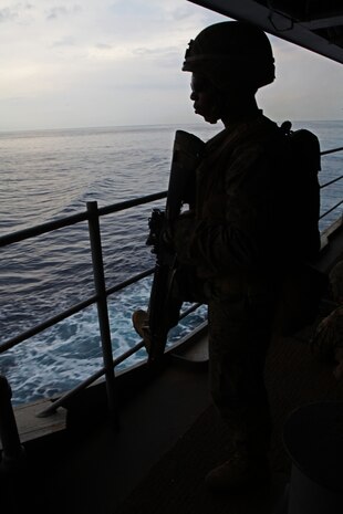 Lance Cpl. Earl Sproul, a rifleman with Charlie Company, Battalion Landing Team 1st Battalion, 2nd Marine Regiment, 24th Marine Expeditionary Unit, holds security during a Defense of the Amphibious Task Force training exercise, Feb 10. While at sea, Marines and Sailors must be prepared to guard the ship whenever it passes a danger area or when there may be an increased threat to the force. The training exercise was a smaller part of the 24th MEU’s Certification Exercise (CERTEX) with the Iwo Jima Amphibious Ready Group, scheduled Jan. 27 to Feb. 17, which includes a series of missions intended to evaluate and certify the unit for their upcoming deployment.