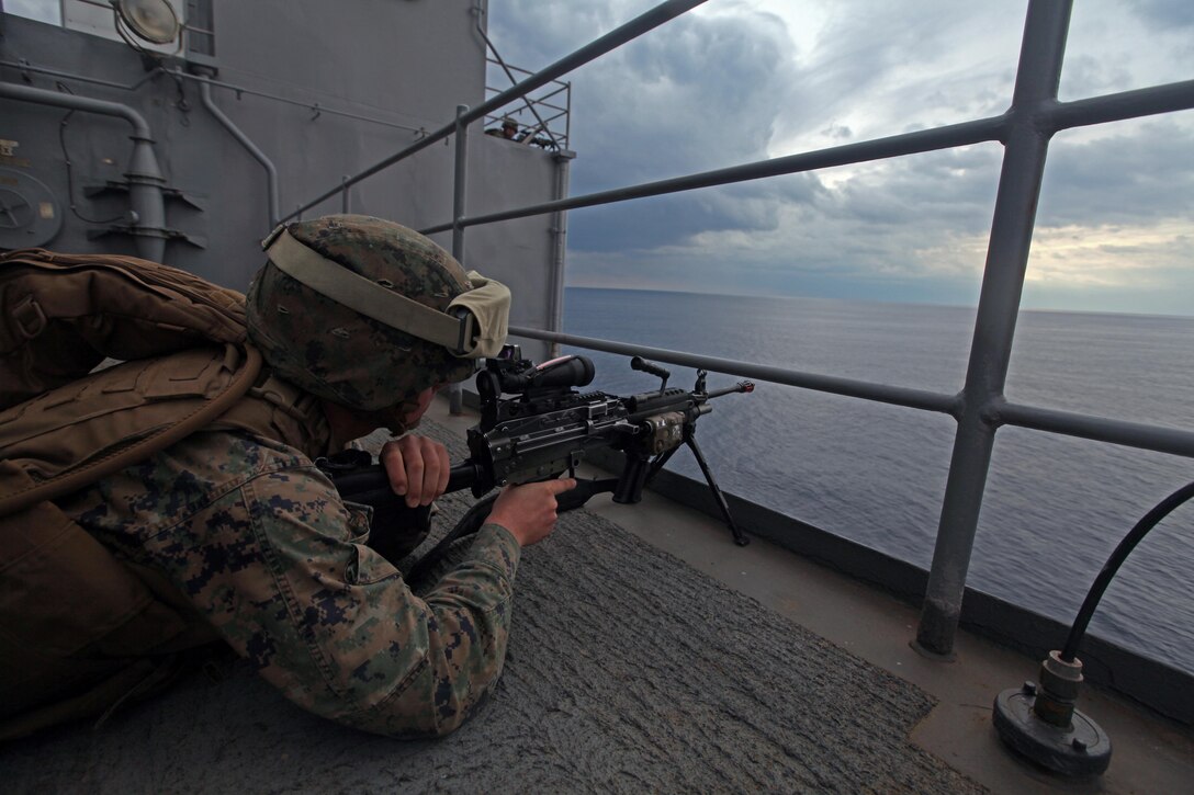 Lance Cpl. Andrew Vaughn, a rifleman with Charlie Company, Battalion Landing Team 1st Battalion, 2nd Marine Regiment, 24th Marine Expeditionary Unit, holds security during a Defense of the Amphibious Task Force training exercise, Feb 10. While at sea, Marines and Sailors must be prepared to guard the ship whenever it passes a danger area or when there may be an increased threat to the force. The training exercise was a smaller part of the 24th MEU’s Certification Exercise (CERTEX) with the Iwo Jima Amphibious Ready Group, scheduled Jan. 27 to Feb. 17, which includes a series of missions intended to evaluate and certify the unit for their upcoming deployment.