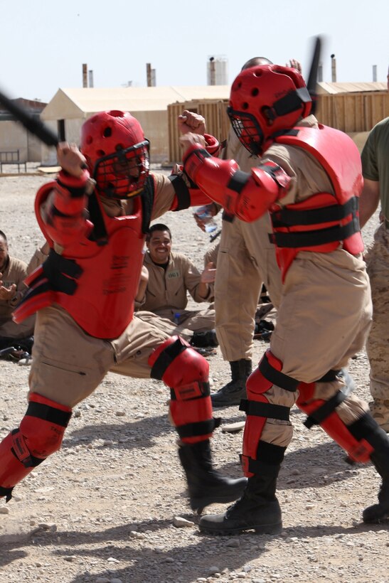 Afghan Uniformed Police recruits participate in a practice match during the baton defensive techniques portion of their course at the Joint Security Academy Southwest on Camp Leatherneck, Helmand province, Afghanistan, April 20.  The recruits spent two days in classroom instruction and practical application in order to familiarize themselves with batons and proper control, compliance and defense techniques.