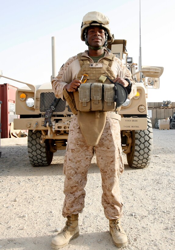 110726-N-SY711-003 LASHKAR GAH, Helmand province July 26 2011) Hospital Corpsman 3rd Class Kossi Noameshie poses before a mission to the Afghan Civil Order Police compound, Lashkar Gah, July 26.  Noameshie often attends to the medical needs of the local Afghan population as well as training the Afghan medics for the ANCOP. (Official U.S. Navy photo by Mass Communication Specialist 2nd Class Matt Snodgrass/Released)
