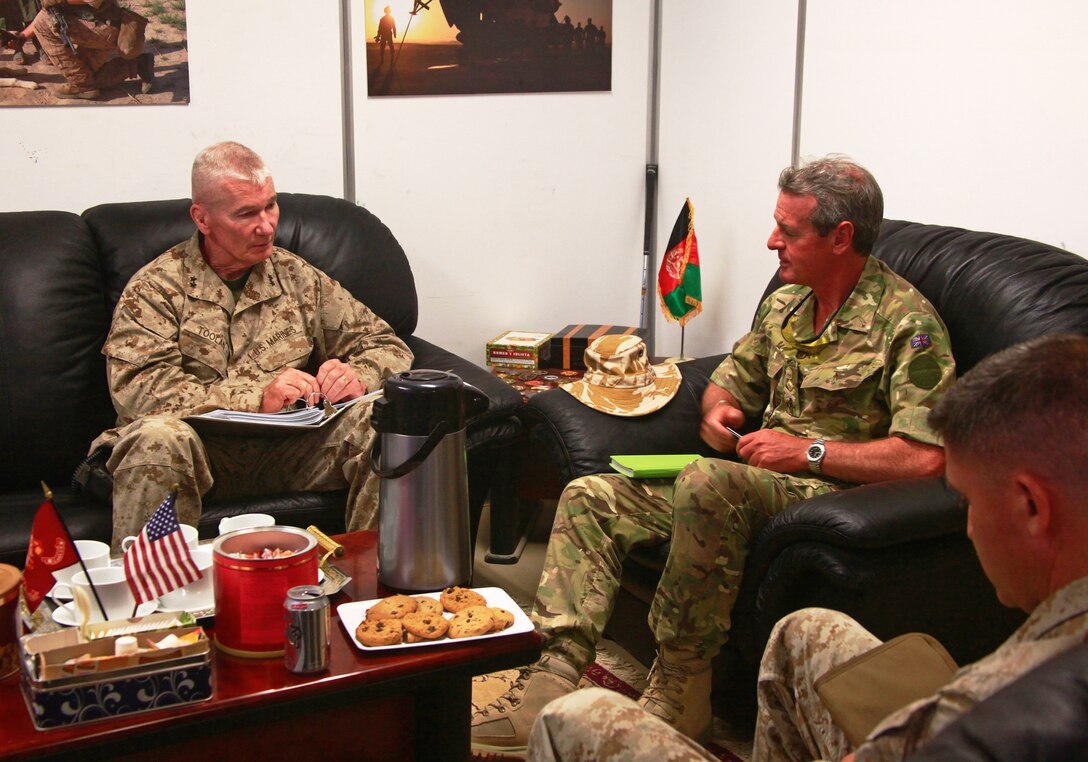 Maj. Gen. John A. Toolan (left), commanding general of Regional Command Southwest, and Lt. Gen. Sir Alexander Richard David Shirreff (right), the Deputy Supreme Allied Commander at NATO, discuss recent progress and future operations, September 6, 2011. Shirreff visited Regional Command Southwest, Sept. 5-6, to see what he can do on a strategic level at NATO to help coalition troops in Afghanistan.