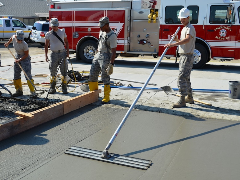 Master Sgt. Matthew Clement, 175th Civil Engineer Squadron structures craftsman, smoothes out freshly poured concrete. During a deployment for training, the 175th CES of the Maryland Air National Guard supported the California Army National Guard at Camp Roberts by constructing a concrete pad for the fire station, three range towers and renovating a dormitory. (National Guard photo)