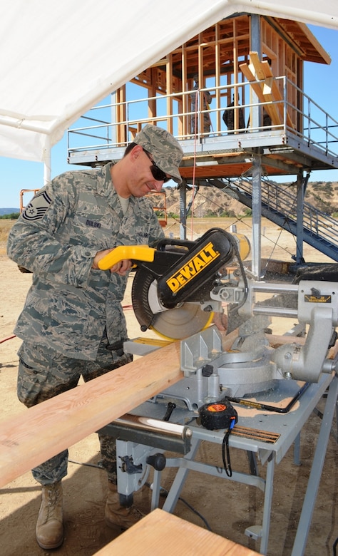 Senior Master Sgt. Martin Dulski, 175th Civil Engineer Squadron heavy repairs superintendant, cuts  2 x 6 boards for a range tower construction project. During a deployment for training, the 175th CES of the Maryland Air National Guard supported the California Army National Guard at Camp Roberts by constructing a concrete pad for the fire station, three range towers and renovating a dormitory. (National Guard photo by Staff Sgt. Tabitha Gomes)