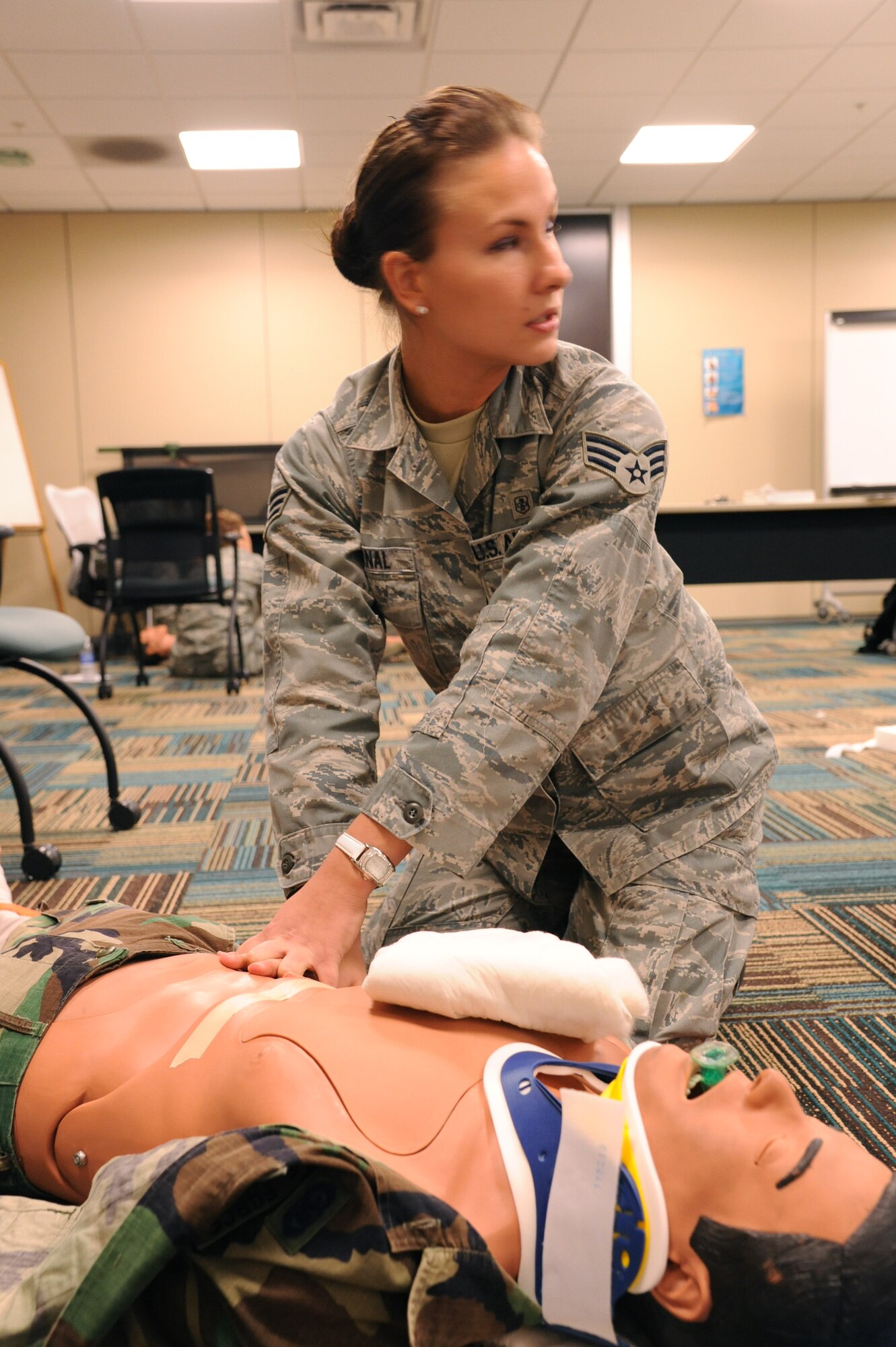 MacDill Air Force Base, Fla. --  Senior Airman Britanee Bernal's job sometimes seems like life and death.  And it can be for the 23 year-old's patients.  Bernal is a basic medical technician with the 927th Aeromedical Staging Squadron, a reserve unit here.  She and 9 other reservists were here re-certifying their skills in an Emergency medical Technician basic refresher course.  (Official U.S. Air Force photo by Staff Sgt. Shawn Rhodes)