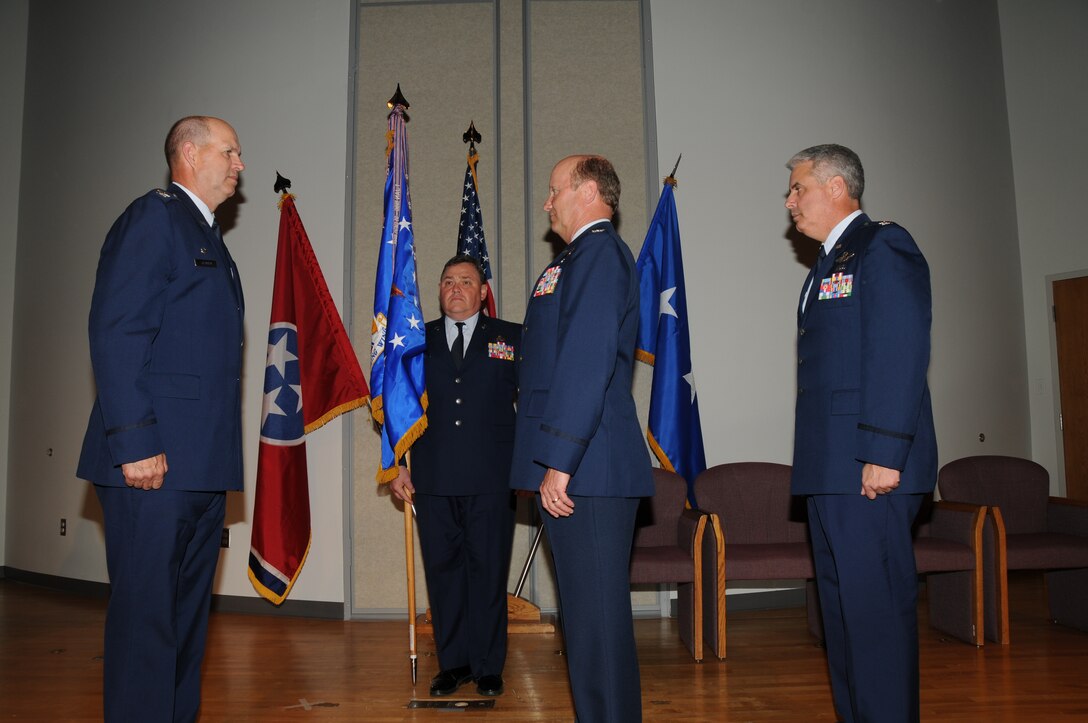 Col. Timothy Dearing prepares to pass the guidon to Brig Gen. Don Johnson at the 134th ARW Change of Command (June 4, 2011). (Also pictured, Col. Thomas Cauthen and Command Chief Master Sgt. Jimmy Long).