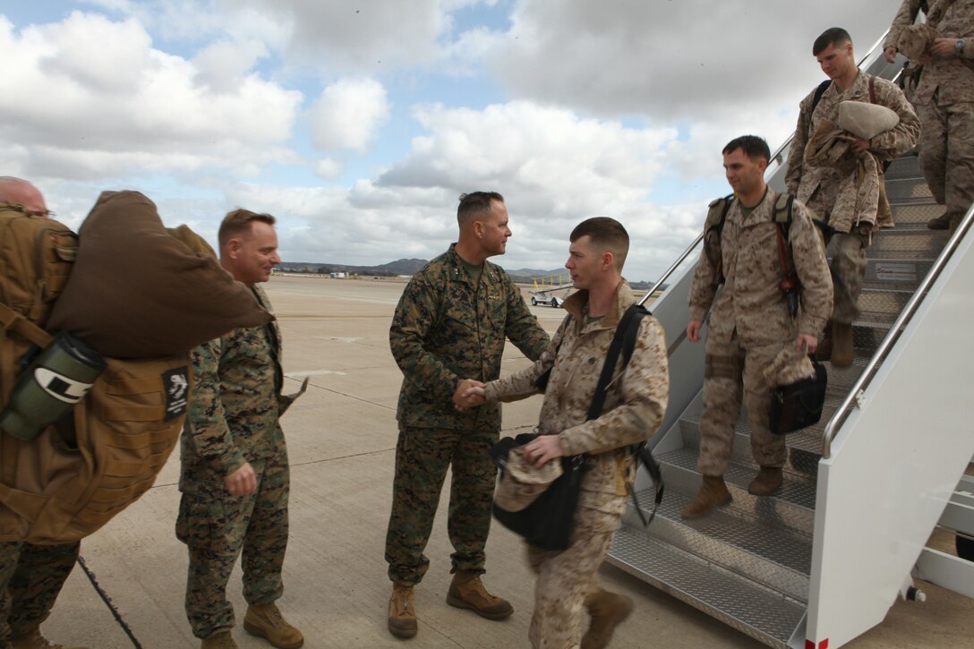 Maj. Gen. Andrew O’Donnell Jr., the 3rd Marine Aircraft Wing commanding general, and Col. Patrick Gramuglia, commanding officer of Marine Aircraft Group 16, greet Marines of Marine Heavy Helicopter Squadron 462 during a welcome home celebration aboard Marine Corps Air Station Miramar Feb. 11. HMH-462, the “Heavy Haulers,” returned from Helmand province, Afghanistan, after a six month deployment.