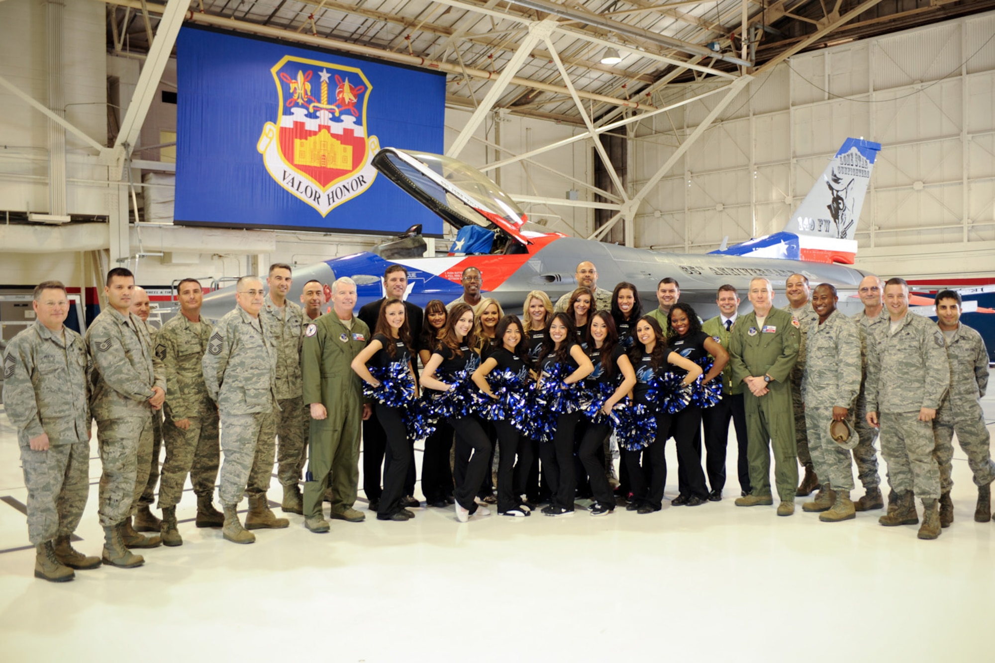 Members of the 149th Fighter Wing, known as the Lone Star Gunfighters, welcome the San Antonio Talons professional arena football team as ?Honorary Commanders? of the Texas Air National Guard unit at Lackland Air Force Base, Texas, on Feb. 11, 2012. (National Guard photo by SSgt Eric Wilson)