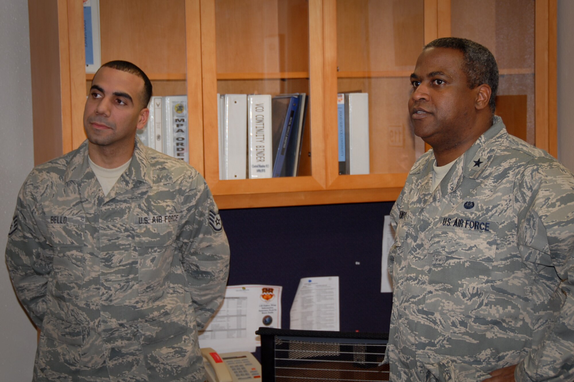 Brig. Gen. Brian C. Newby, chief of staff for the Texas Air National Guard, visits with Staff Sgt. Edwin Bello, a member of the 149th Fighter Wing, also known as the Lone Star Gunfighters, at Lackland Air Force Base, Texas, during the unit training assembly, or UTA, Feb. 11, 2012. (National Guard photo by Staff Sgt. Phil Fountain / Released)