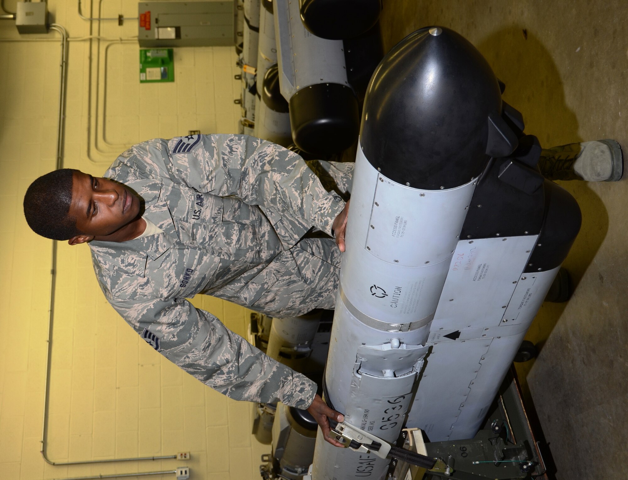 Staff Sgt. Ousseynou S. Sonko, an avionics sensors and electronic warfare systems mechanic in the 175th Maintenance Squadron, moves an electronic countermeasures pod. (National Guard photo by Master Sgt. Ed Bard)