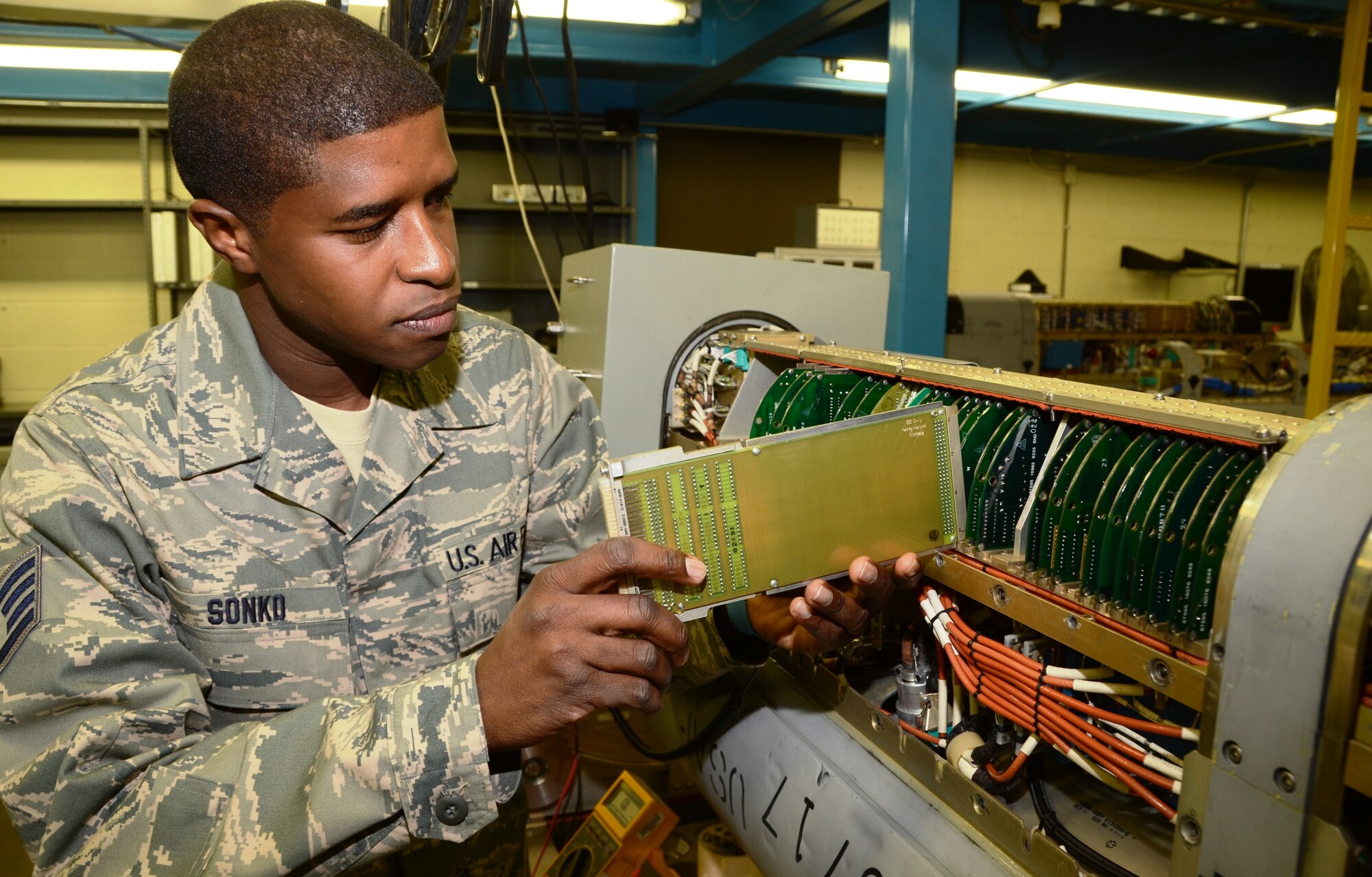 Staff Sgt. Ousseynou S. Sonko, avionics sensors and electronic warfare systems mechanic in the 175th Maintenance Squadron, resets a card on an electronic countermeasures pod. (National Guard photo by Master Sgt. Ed Bard)