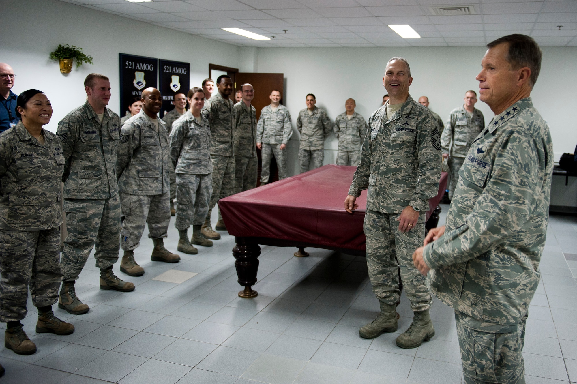 Gen. William M. Fraser III, U.S. Transportation Command commander, right, speaks with 728th Air Mobility Airmen, Feb. 9, 2012, at Incirlik Air Base, Turkey. Fraser received a briefing from wing leadership, toured several base facilities and visited with Airmen to thank them for their hard work. (U.S. Air Force photo by Tech. Sgt. Michael B. Keller/Released)