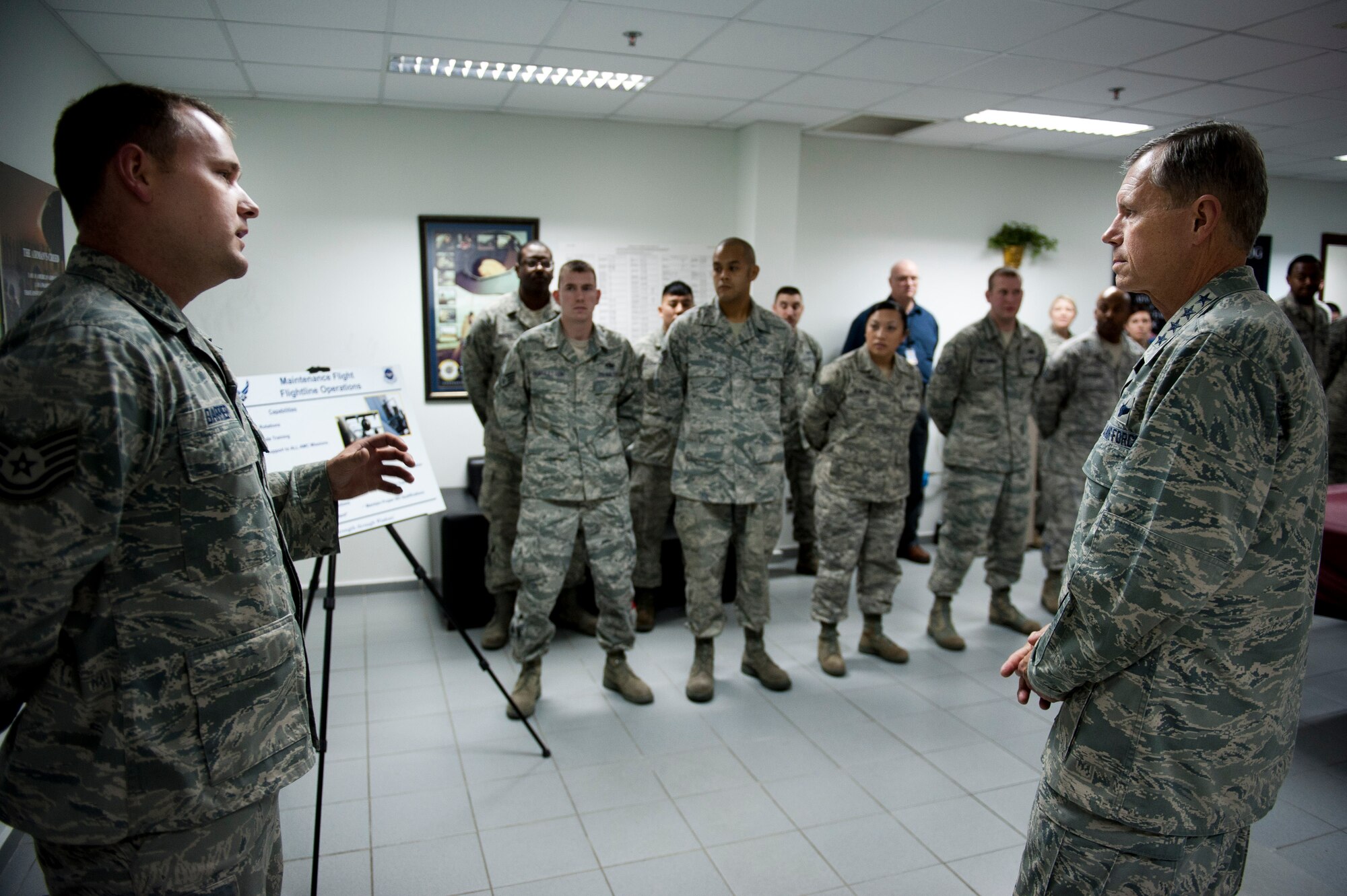 Gen. William M. Fraser III, U.S. Transportation Command commander, right, receives a mission briefing from Tech. Sgt. Scott Barrier, 728th Air Mobility Squadron, Feb. 9, 2012, at Incirlik Air Base, Turkey. Fraser received a briefing from wing leadership, toured several base facilities and visited with Airmen to thank them for their hard work. (U.S. Air Force photo by Tech. Sgt. Michael B. Keller/Released)