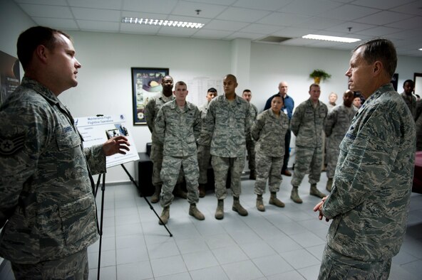 Gen. William M. Fraser III, U.S. Transportation Command commander, right, receives a mission briefing from Tech. Sgt. Scott Barrier, 728th Air Mobility Squadron, Feb. 9, 2012, at Incirlik Air Base, Turkey. Fraser received a briefing from wing leadership, toured several base facilities and visited with Airmen to thank them for their hard work. (U.S. Air Force photo/Tech. Sgt. Michael B. Keller)(Released)