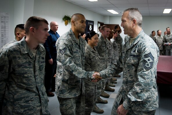 Chief Master Sgt. Martin Klukas, U.S. Transportation Command senior enlisted leader, shakes hands with 728th Air Mobility Squadron Airmen Feb. 9, 2012, at Incirlik Air Base, Turkey. Klukas toured Incirlik with Gen. William M. Fraser III, U.S. Transportation Command commander, where they received a briefing from wing leadership, visited several base facilities and spoke with Airmen to thank them for their hard work. (U.S. Air Force photo/Tech. Sgt. Michael B. Keller)(Released)