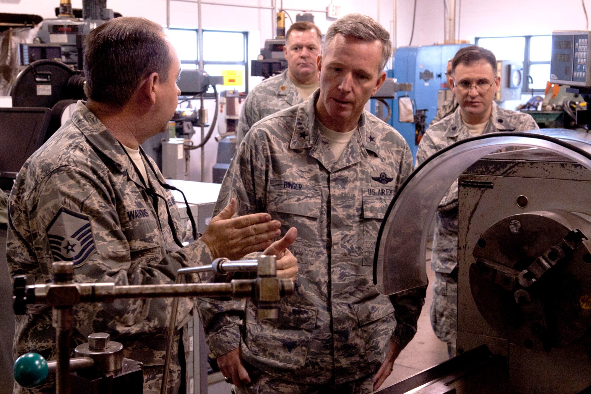 U.S. Air Force Master Sgt. Gene Watkins, 307th Maintenance Squadron metals technology supervisor, gives Brig. Gen. William Binger, 10th Air Force commander, a tour of the machine shop, Barksdale Air Force Base, La., Feb. 10, 2012. Binger assumed command of 10th AF in Nov. 2011, and this was his first visit to the 307th Bomb Wing. (U.S. Air Force photo by Master Sgt. Greg Steele/Released)