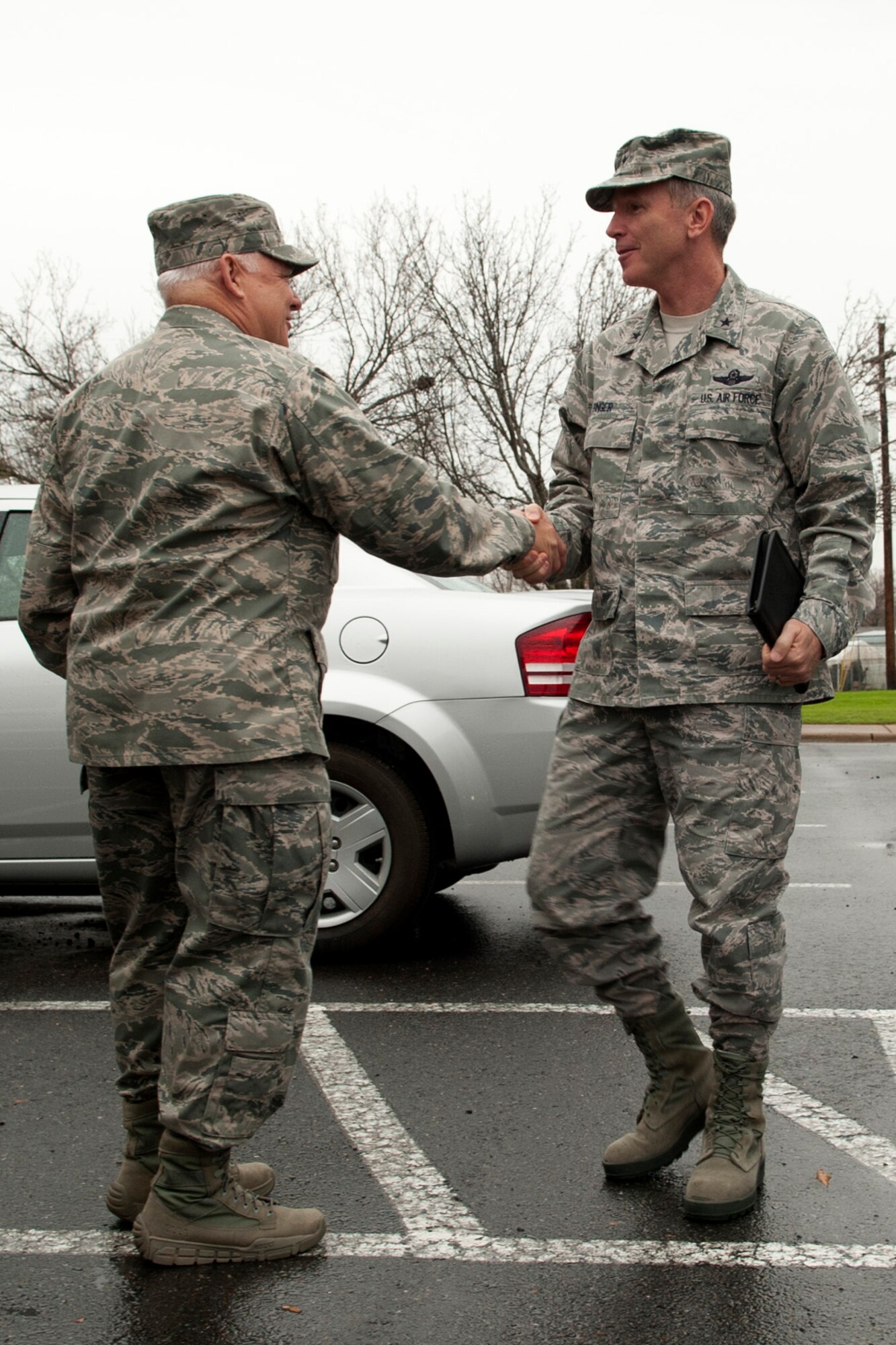 U.S. Air Force Col. Kevin Wolfe, 307th Mission Support Group commander, welcomes Brig. Gen. William Binger, 10th Air Force commander, during his visit to Barksdale Air Force Base, La., Feb. 10, 2012. Binger's command includes all fighter, bomber, special operations, rescue, airborne warning and control, flying training, combat air operations battle staff, remotely piloted aircraft, space and cyber units in the Air Force Reserve Command. (U.S. Air Force photo by Master Sgt. Greg Steele/Released)