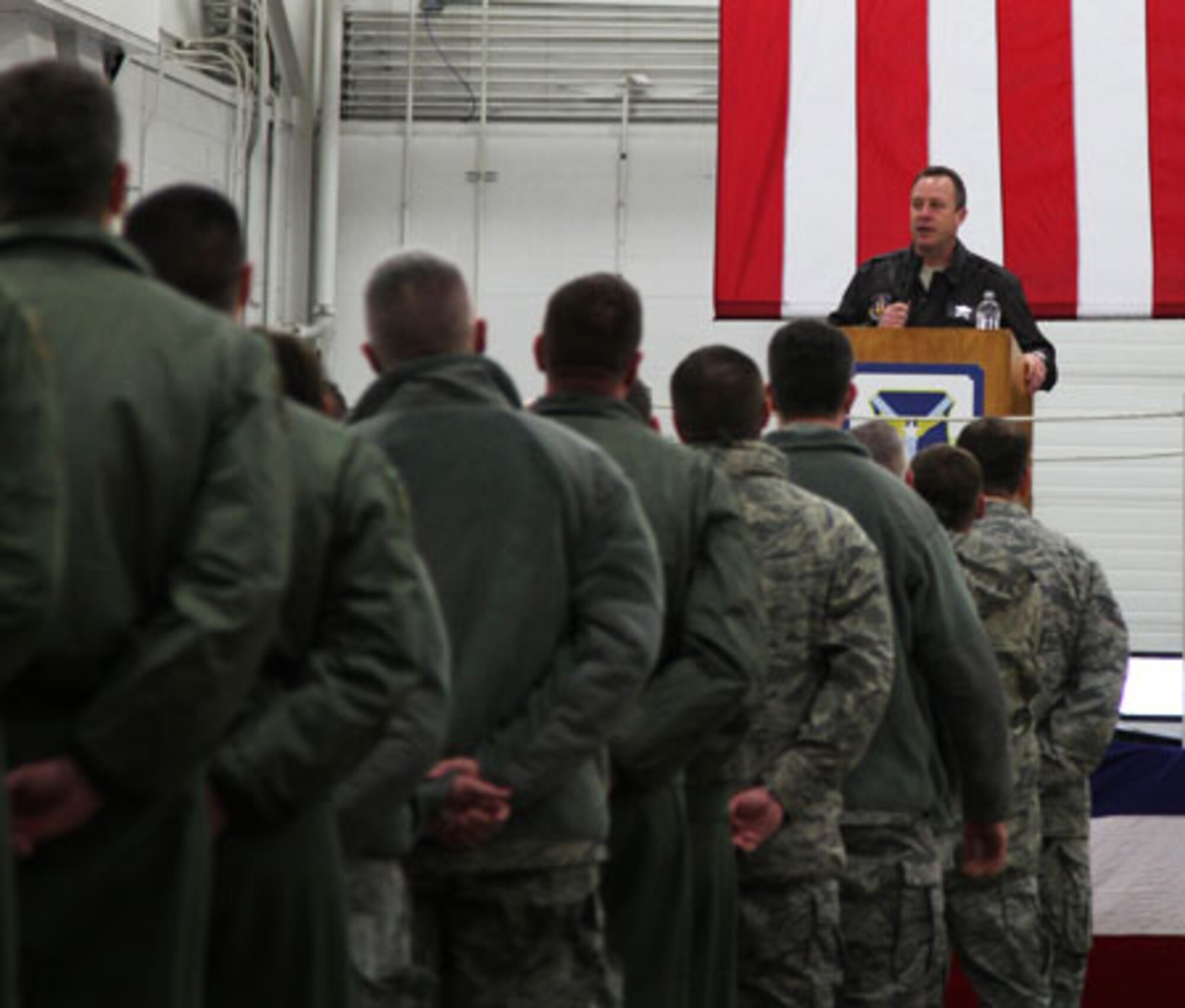 Col. James B. Finney, 911th Airlift Wing commander, briefs unit members during commander’s call held in Hangar 416 during the February Unit Training Assembly, Feb. 12, 2012. The purpose of the briefing was to inform unit members on the recent announcement of Force Structure changes within the Department of the Air Force. (U.S. Air Force photo by Tech. Sgt. Ralph Van Houtem/ Released)
