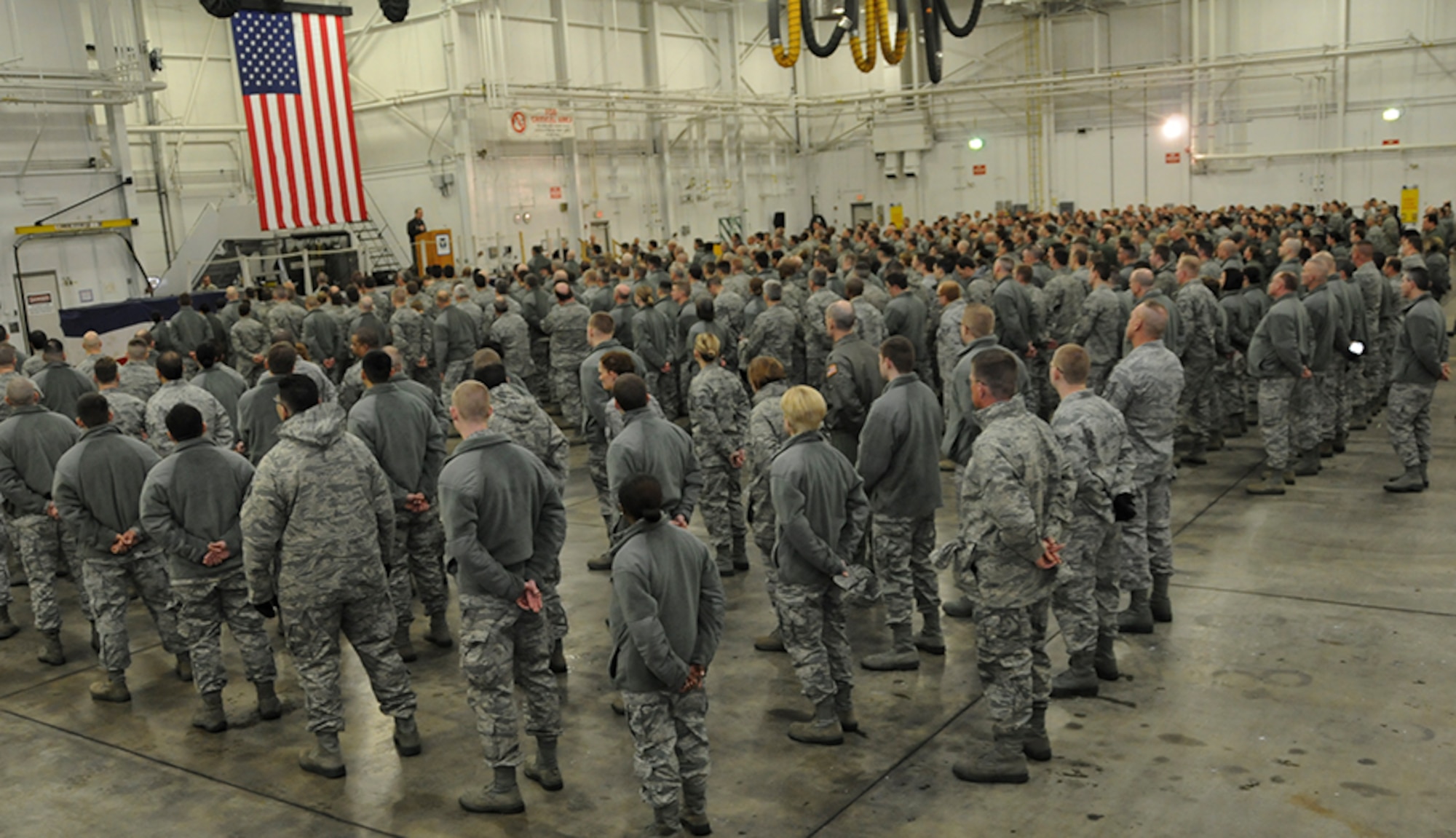 Col. James B. Finney, 911th Airlift Wing commander, briefs unit members during commander’s call held in Hangar 416 during the February Unit Training Assembly, Feb. 12, 2012. The purpose of the briefing was to inform unit members on the recent announcement of Force Structure changes within the Department of the Air Force. (U.S. Air Force photo by Tech. Sgt. Ralph Van Houtem/ Released)