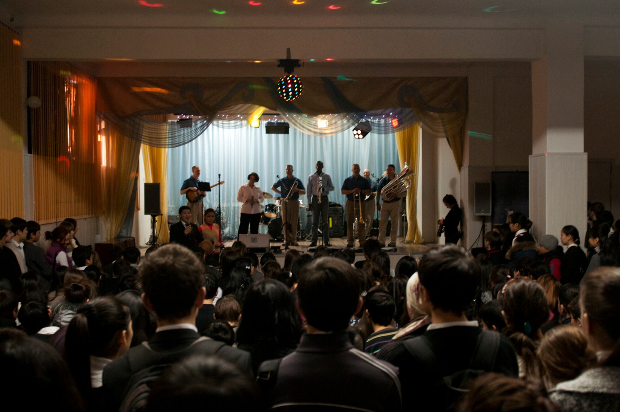 Members of the U.S. Air Forces Central  Band Afterburner, perform, Feb. 1, 2012, at School #62 in Bishkek, Kyrgyzstan. Afterburner is a classic rock band that consists of nine Airmen who will perform at five schools in Kyrgyzstan. School #62 has more than 2,000 students. (U.S. Air Force Photo by Staff Sgt. David Salanitri/Released) 


