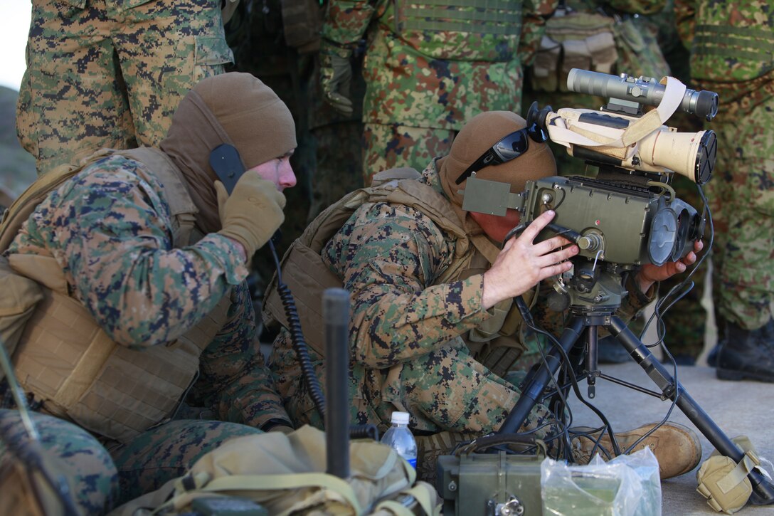 Sgt. Todd J. Lawlor, radio operator, 1st Air Naval Gunfire Liaison Company receives information over a radio during a combined arms exercise with the Japanese Ground Self Defense Force, Feb. 12. The exercise included 81 and 120mm mortars, fixed and rotary wing assets and Naval gun fire.  In addition to the gunfire exercise, the Japanese also practiced calling for fire. Exercise Iron Fist 2012 is a bilateral training exercise that gave the 15th MEU a chance to demonstrate its amphibious capabilities to the Japanese. Lawlor, 23, is from Milpitas, Calif.